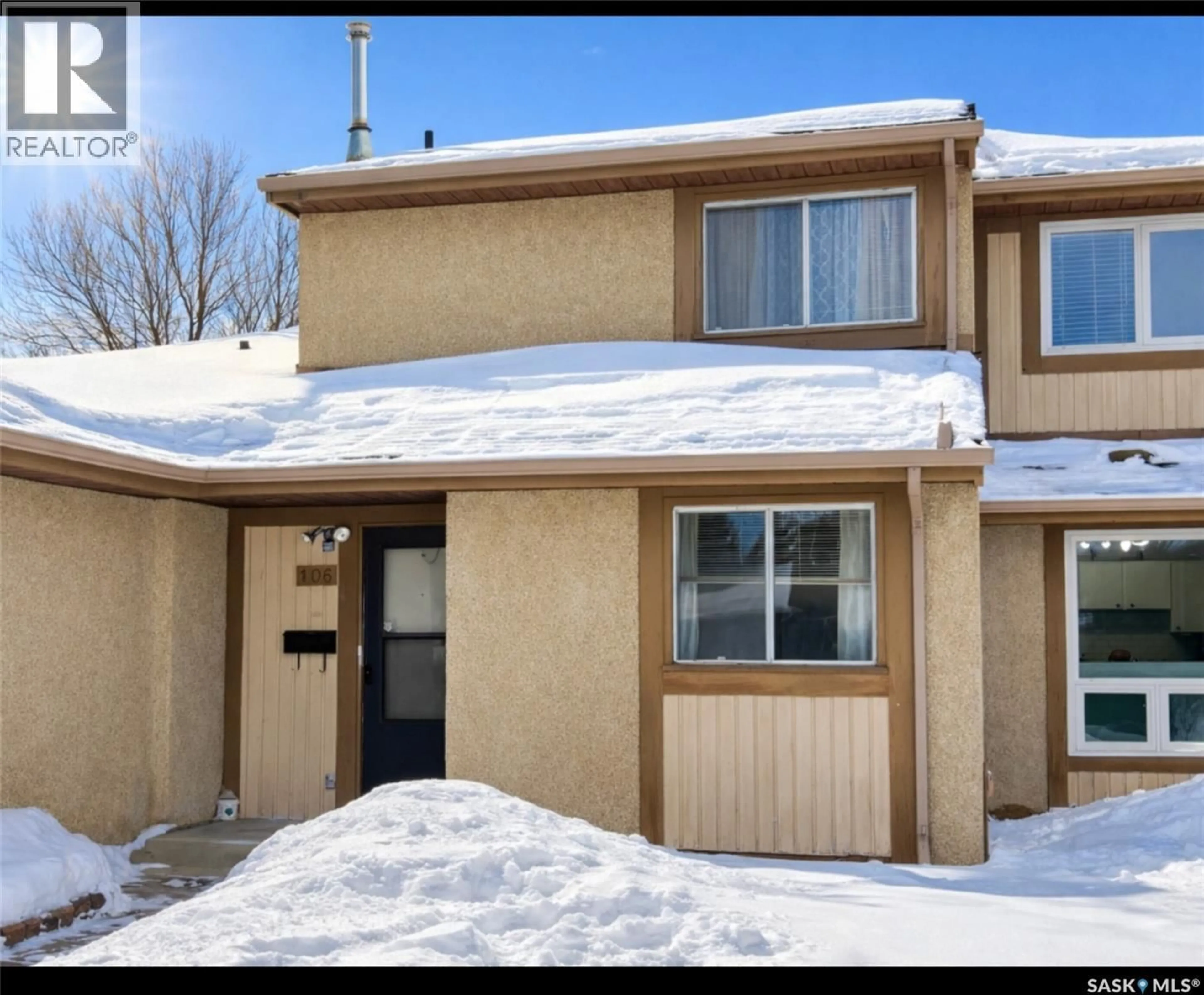 Home with vinyl exterior material, street for 106 - 1128 MCKERCHER DRIVE, Saskatoon Saskatchewan S7H4Y7