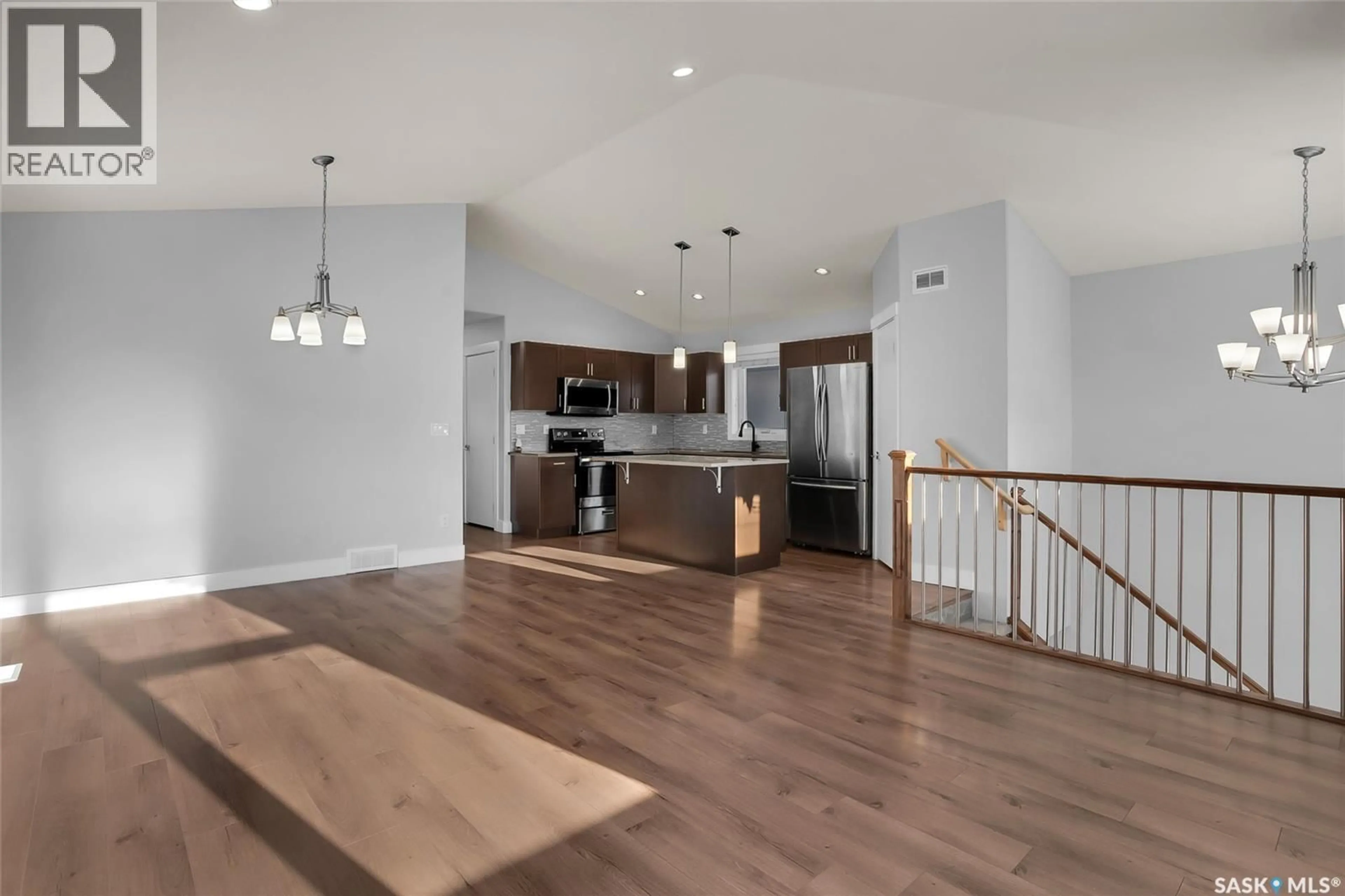 Open concept kitchen, wood/laminate floor for 315 EATON LANE, Saskatoon Saskatchewan S7V0H3