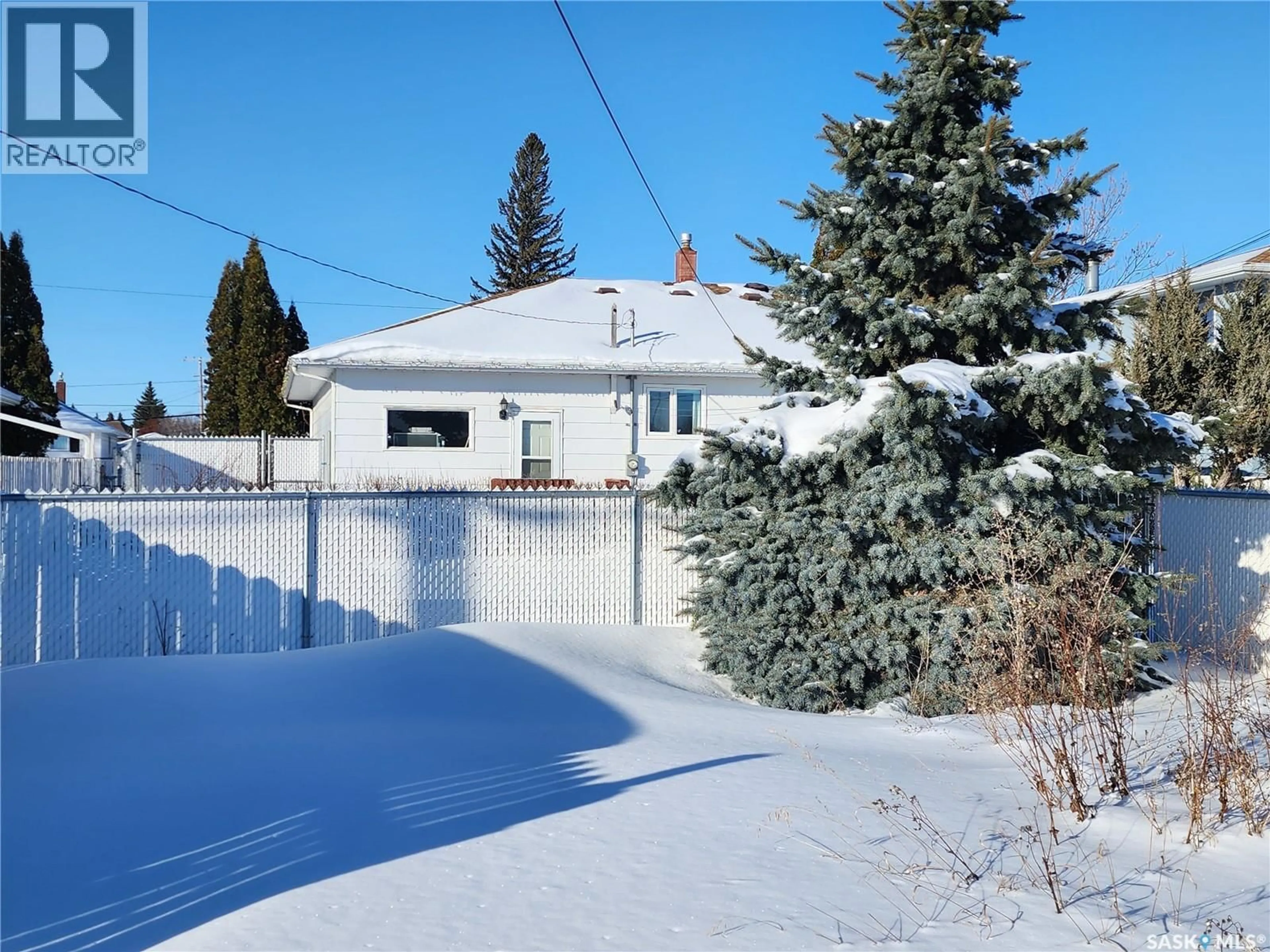 Home with vinyl exterior material, street for 1032 MAIN STREET, Melville Saskatchewan S0A2P0