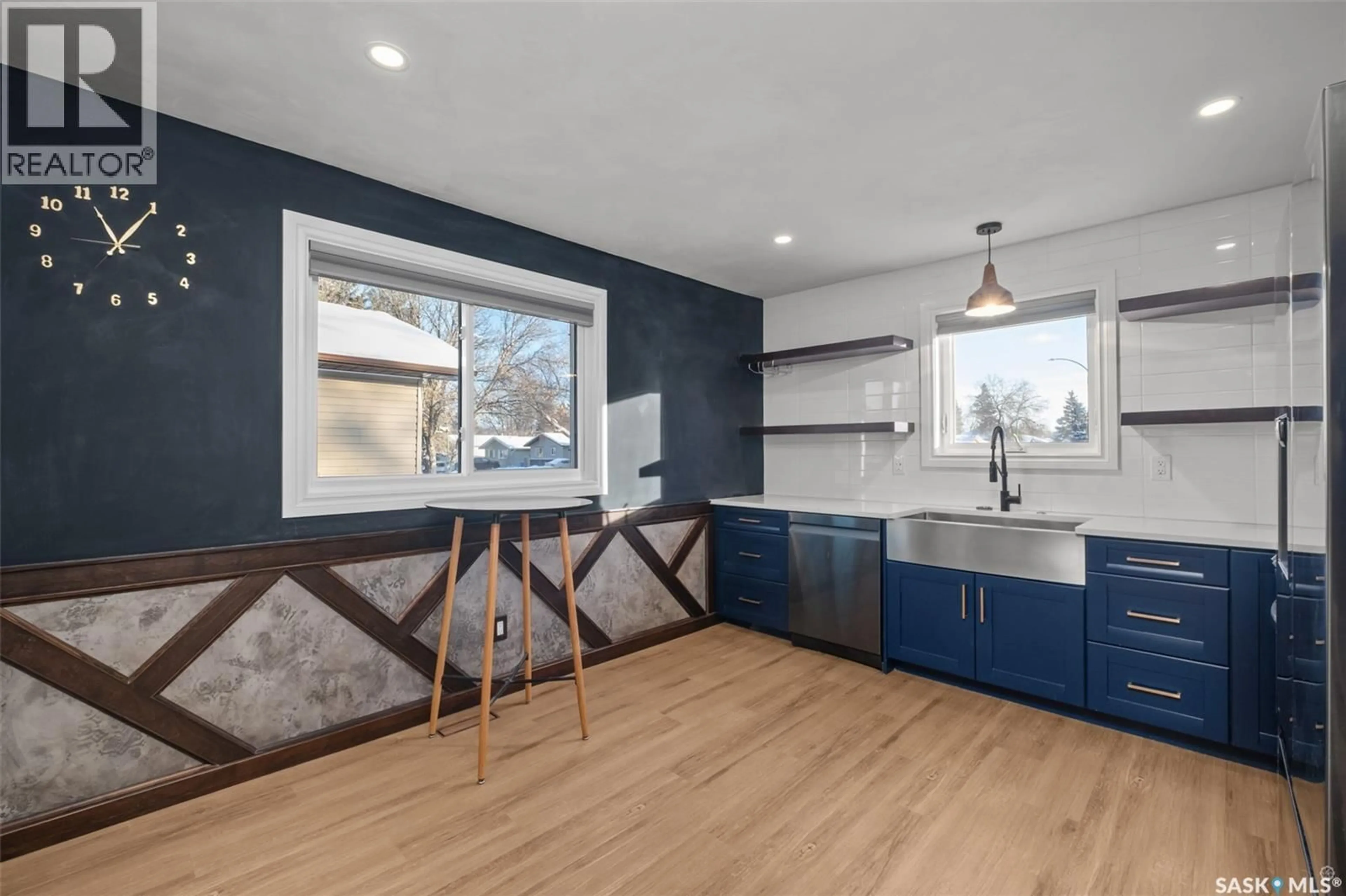 Open concept kitchen, wood/laminate floor for 125 MCINTOSH DRIVE, Prince Albert Saskatchewan S6V6H2