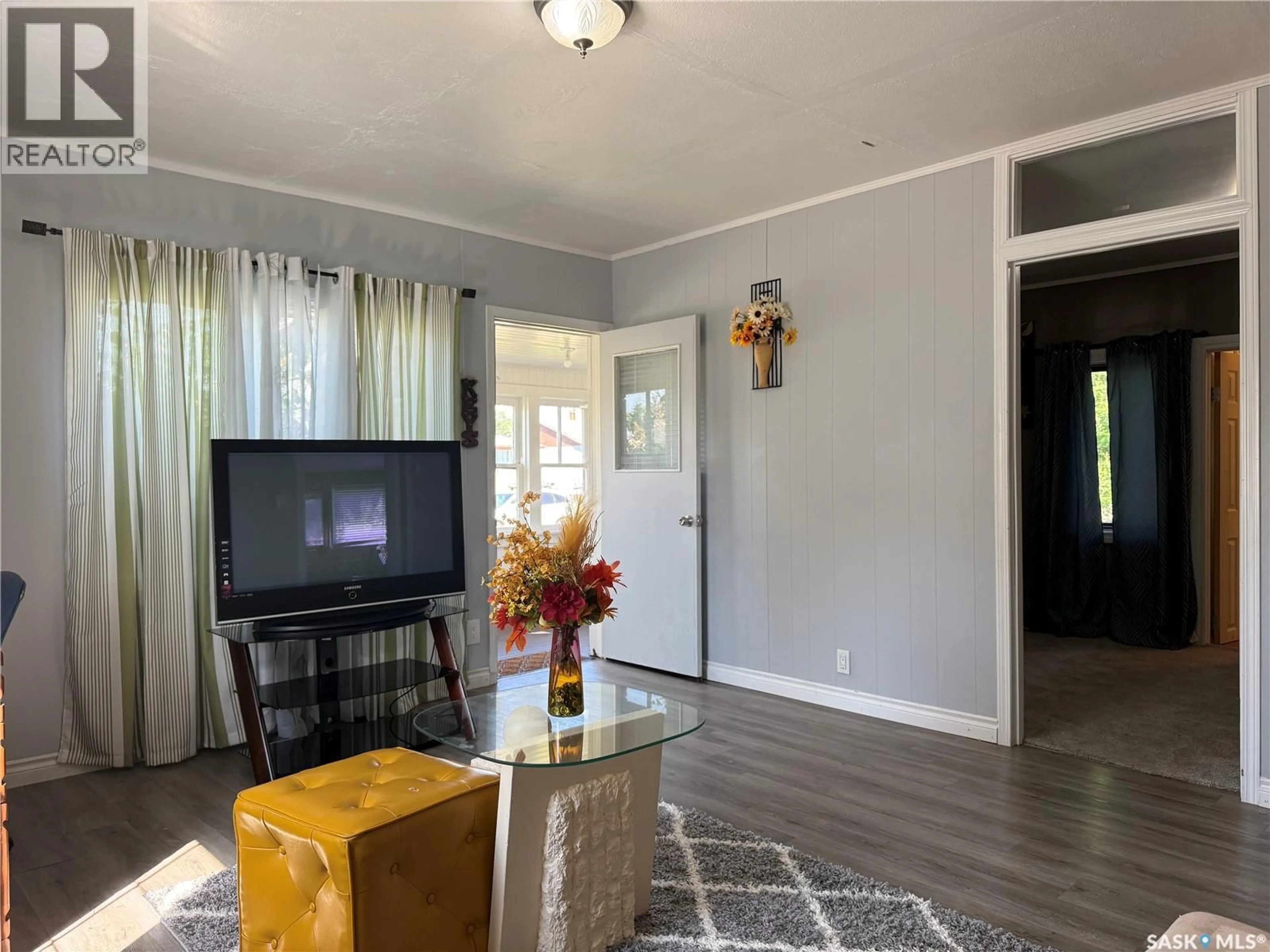 Living room with furniture, wood/laminate floor for 573 4TH AVENUE, Melville Saskatchewan S0A2P0