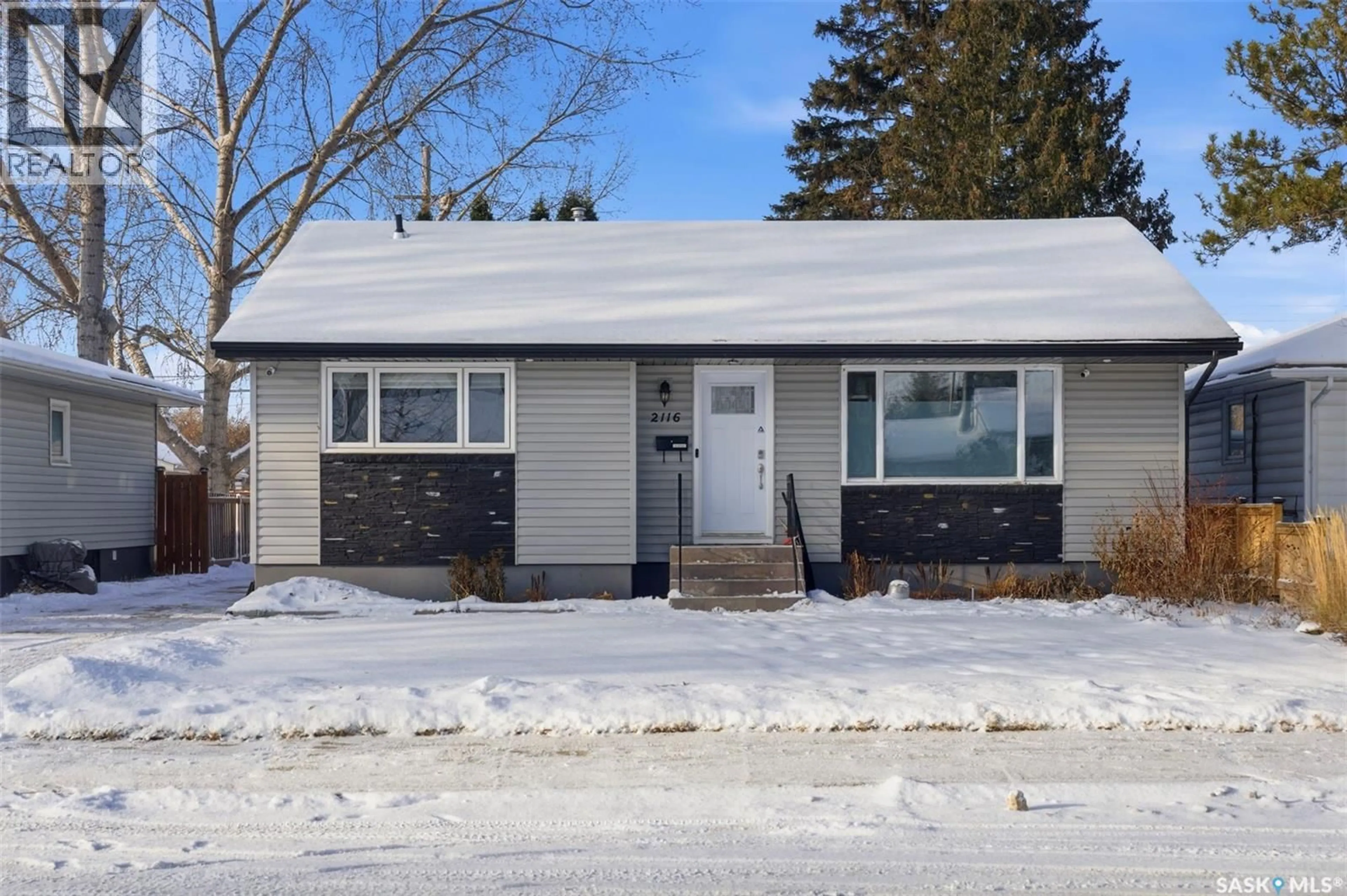Home with vinyl exterior material, street for 2116 CUMBERLAND AVENUE, Saskatoon Saskatchewan S7J1Z3