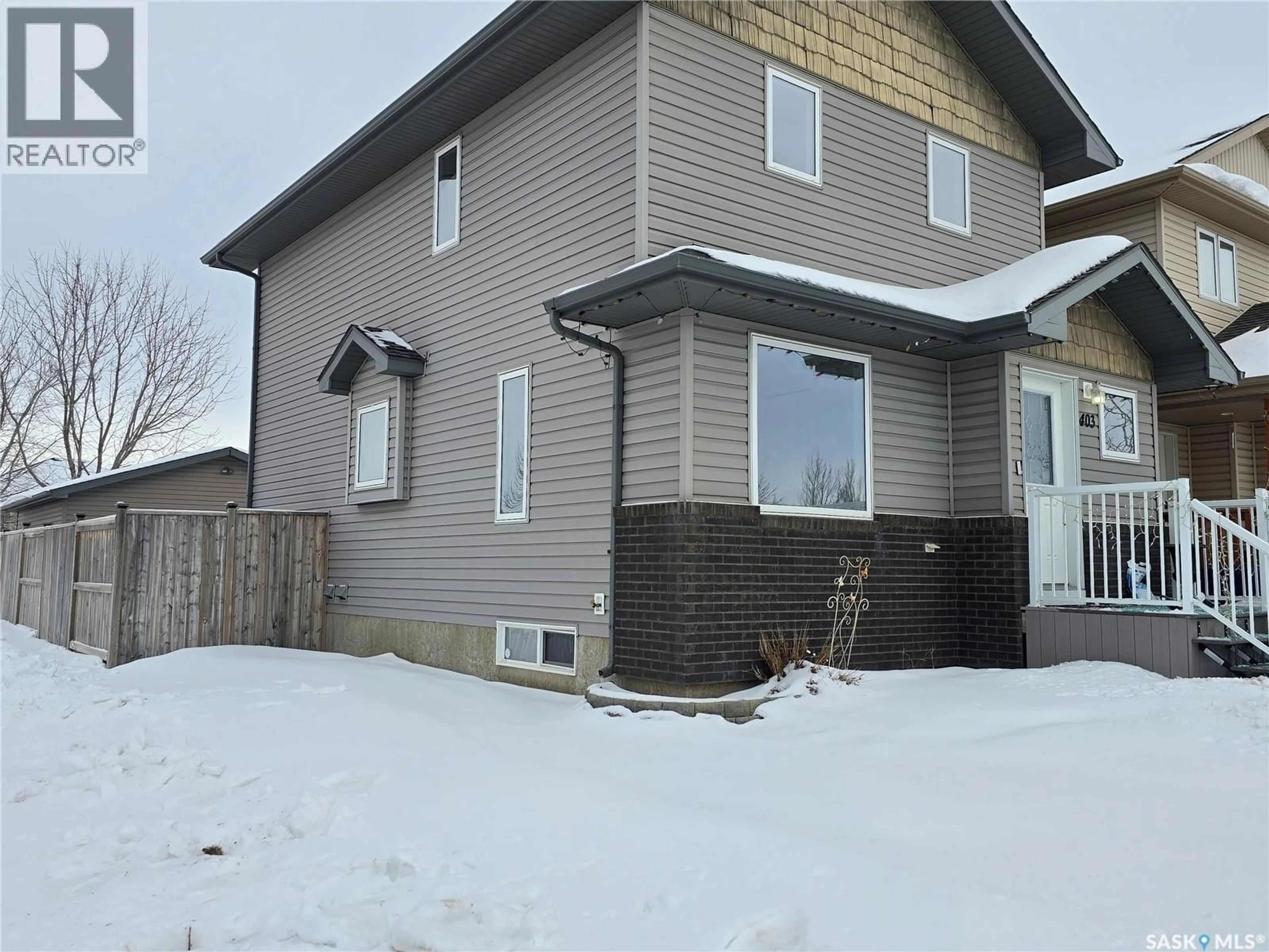 A pic from outside/outdoor area/front of a property/back of a property/a pic from drone, street for 403 GORDON ROAD, Saskatoon Saskatchewan S7T0A1