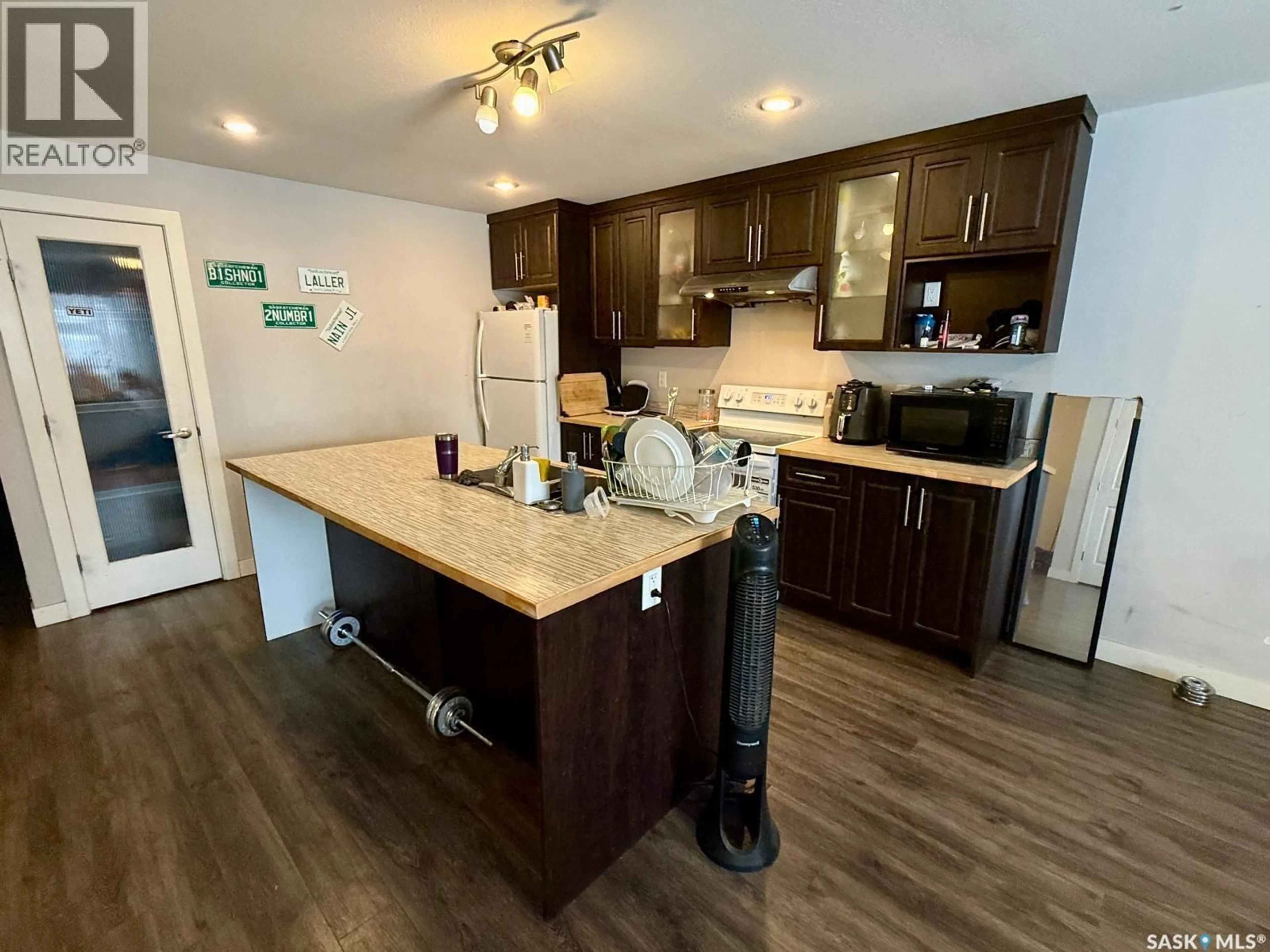 Open concept kitchen, wood/laminate floor for 2260 MONTREAL STREET, Regina Saskatchewan S4P1L6