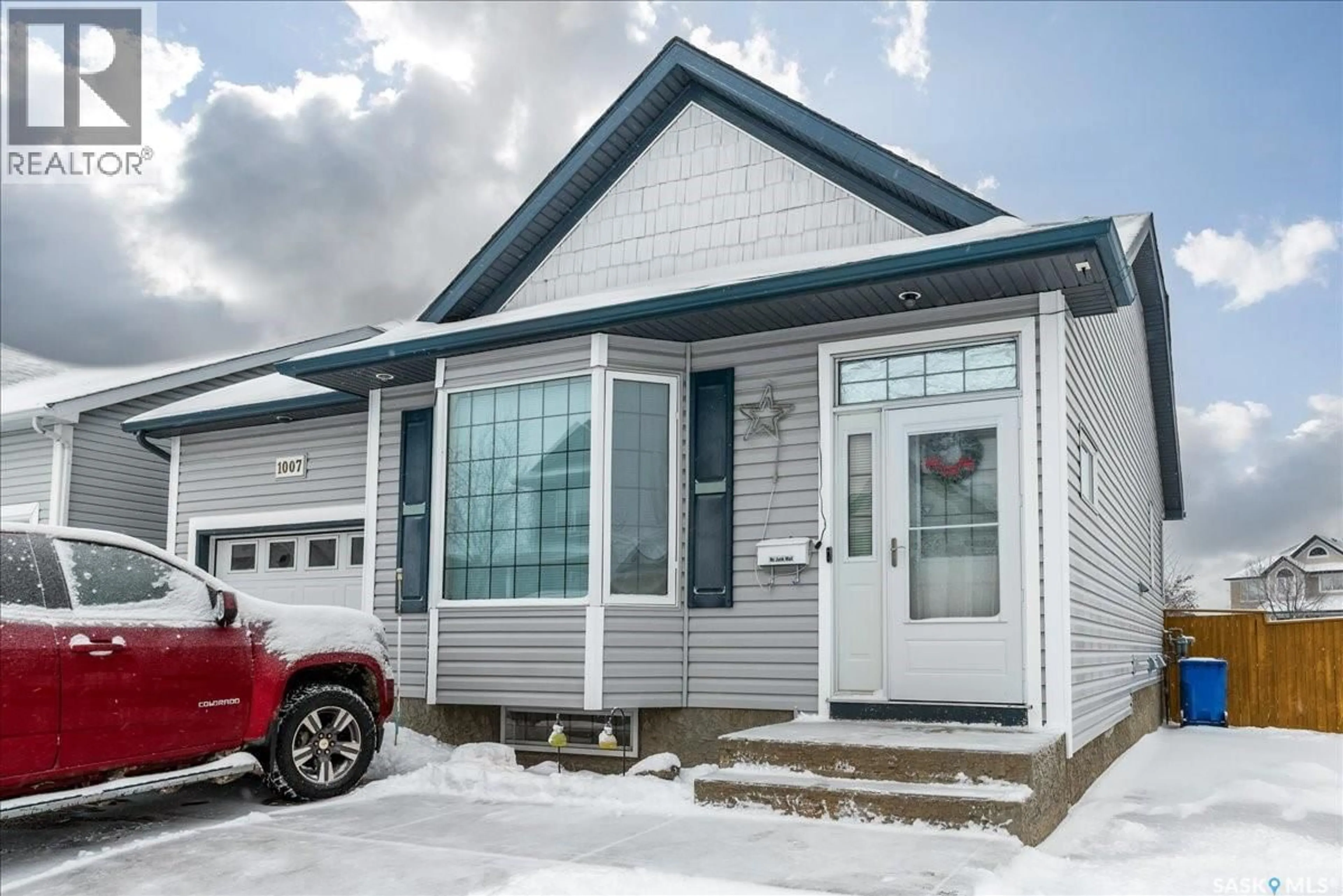 Home with vinyl exterior material, street for 1007 CYPRESS WAY, Regina Saskatchewan S4X4R5