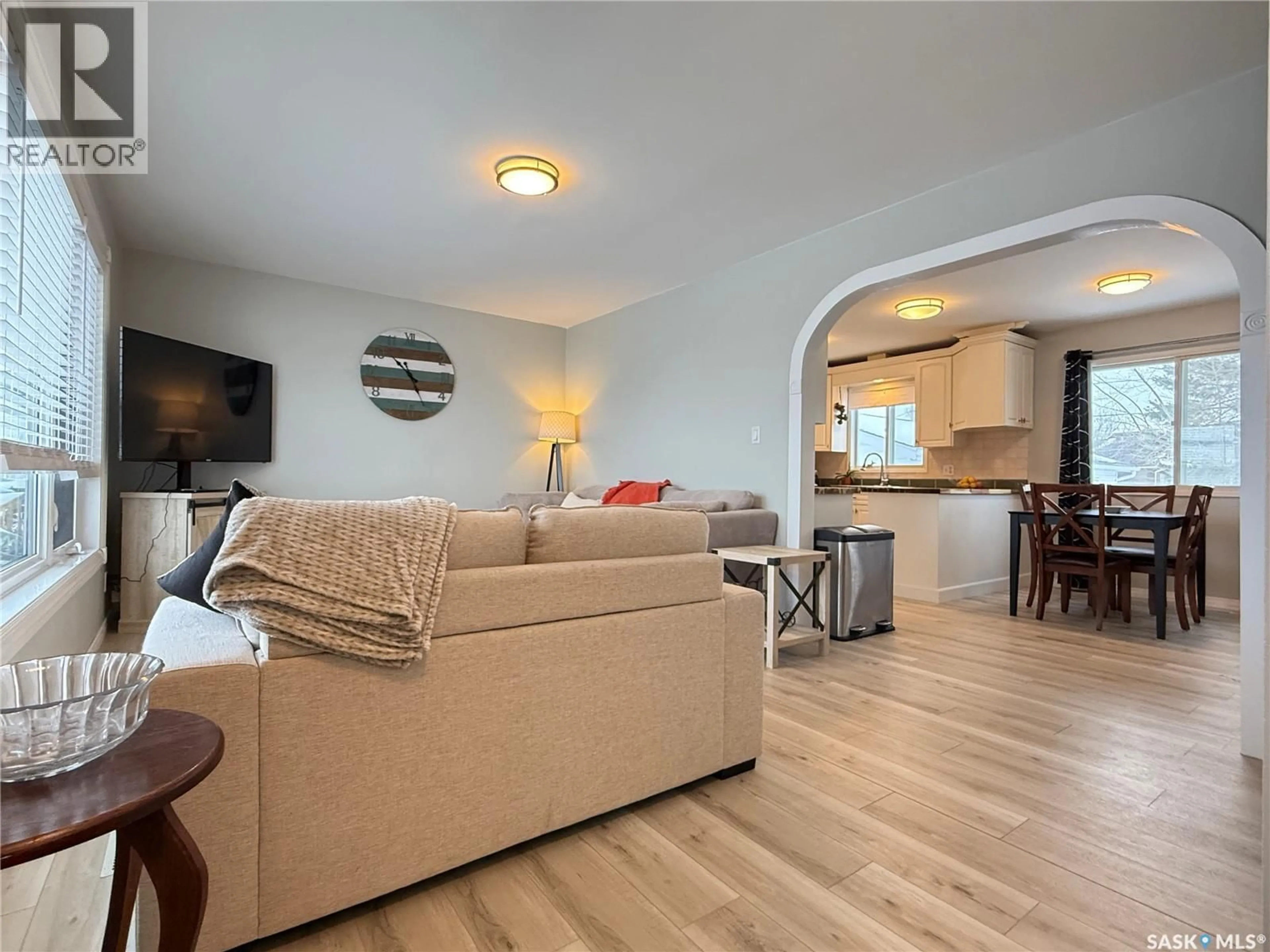 Living room with furniture, wood/laminate floor for 11 QUEBEC DRIVE, Melville Saskatchewan S0A2P0