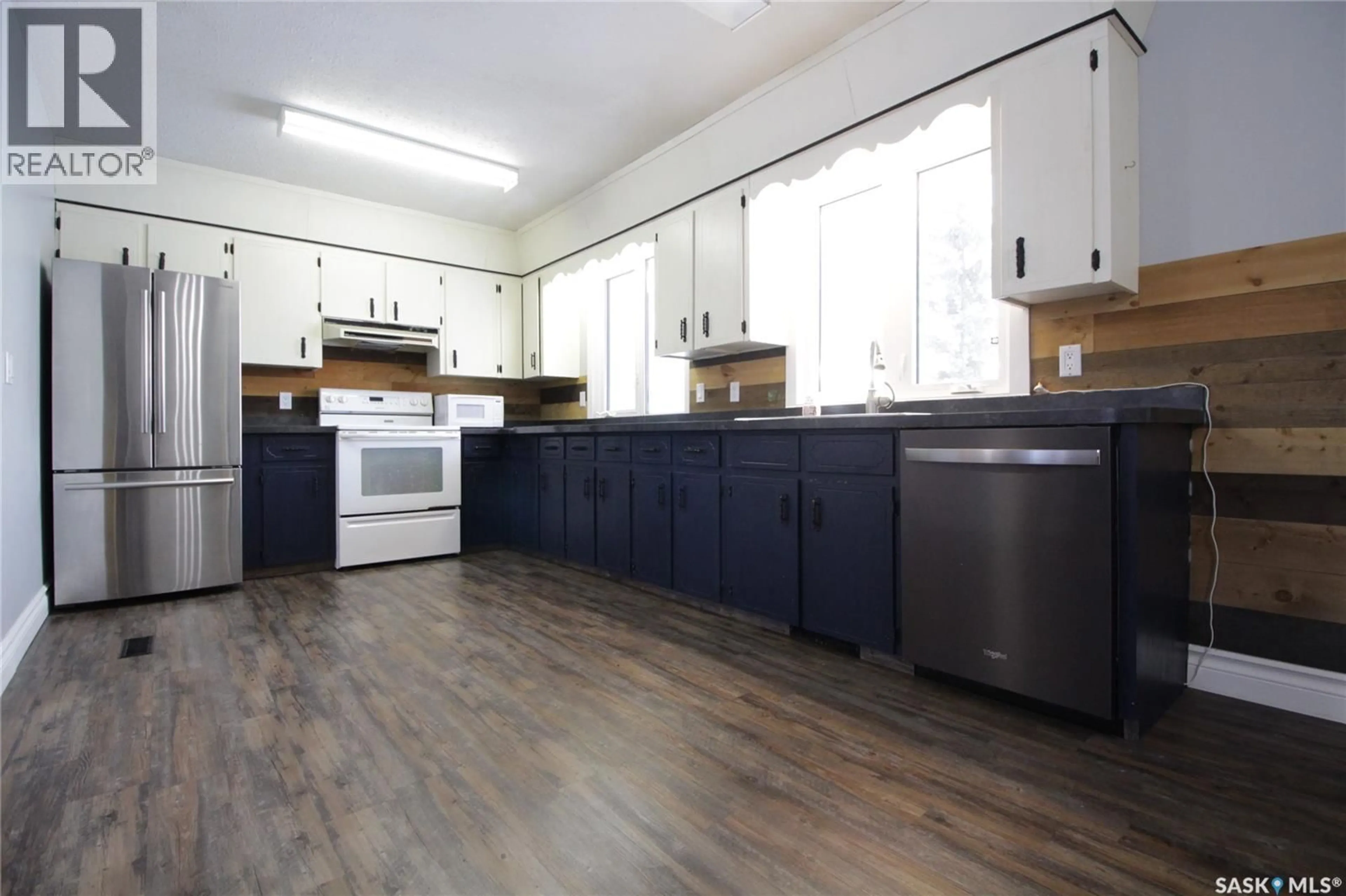 Open concept kitchen, wood/laminate floor for 302 3RD AVENUE, Whitewood Saskatchewan S0G5C0