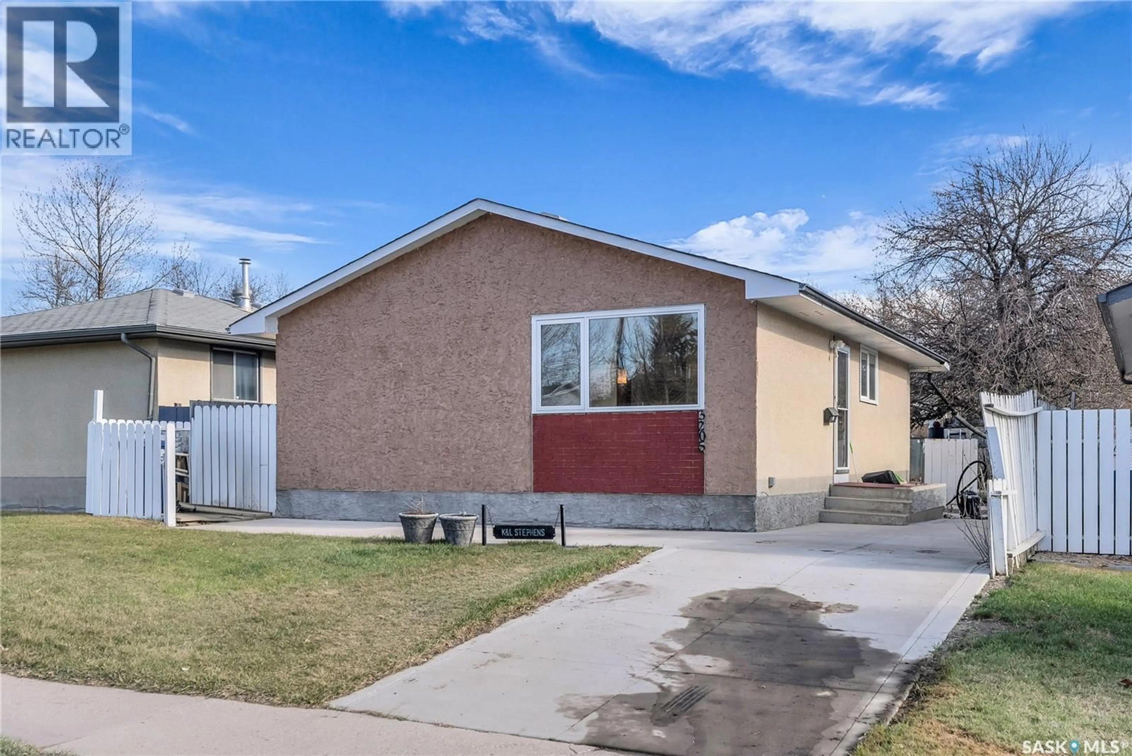 Home with vinyl exterior material, street for 3205 33RD STREET, Saskatoon Saskatchewan S7L4R1