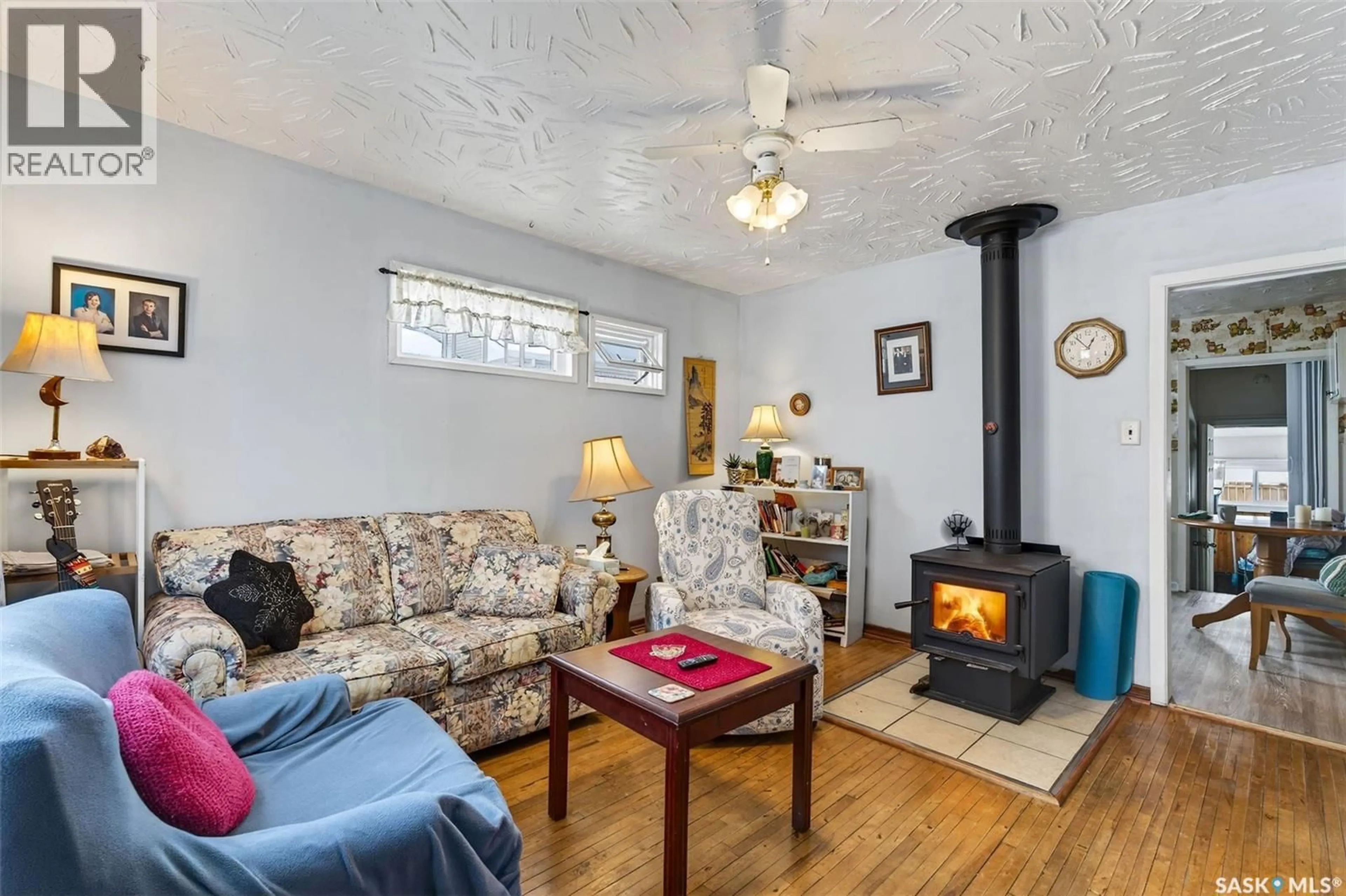 Living room with furniture, wood/laminate floor for 1603 13TH STREET, Prince Albert Saskatchewan S6V3J9