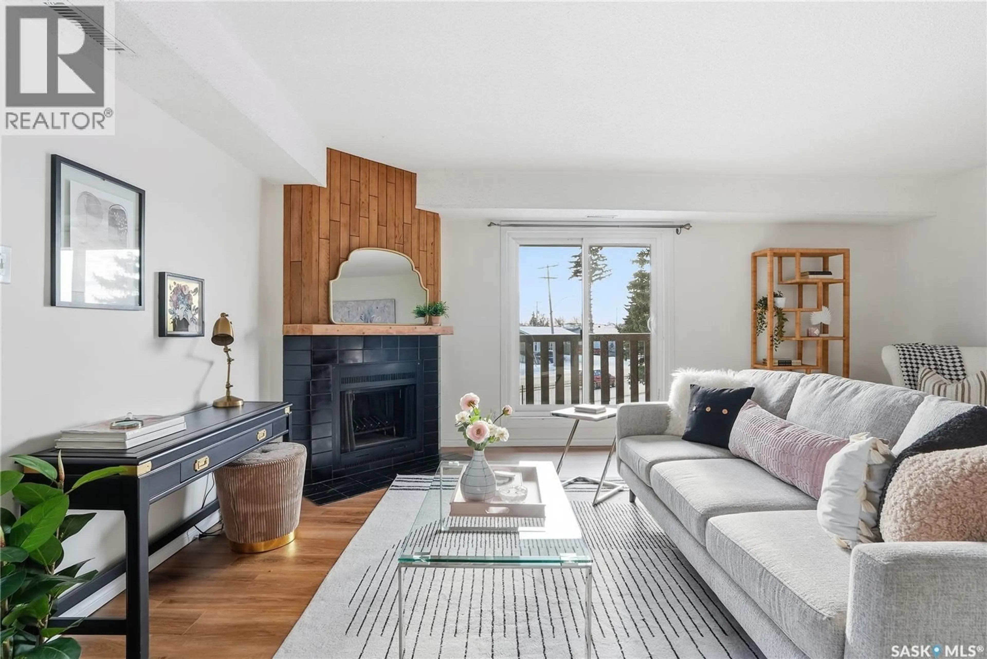 Living room with furniture, wood/laminate floor for 510 - 524 PRAIRIE AVENUE, Saskatoon Saskatchewan S7N2V4