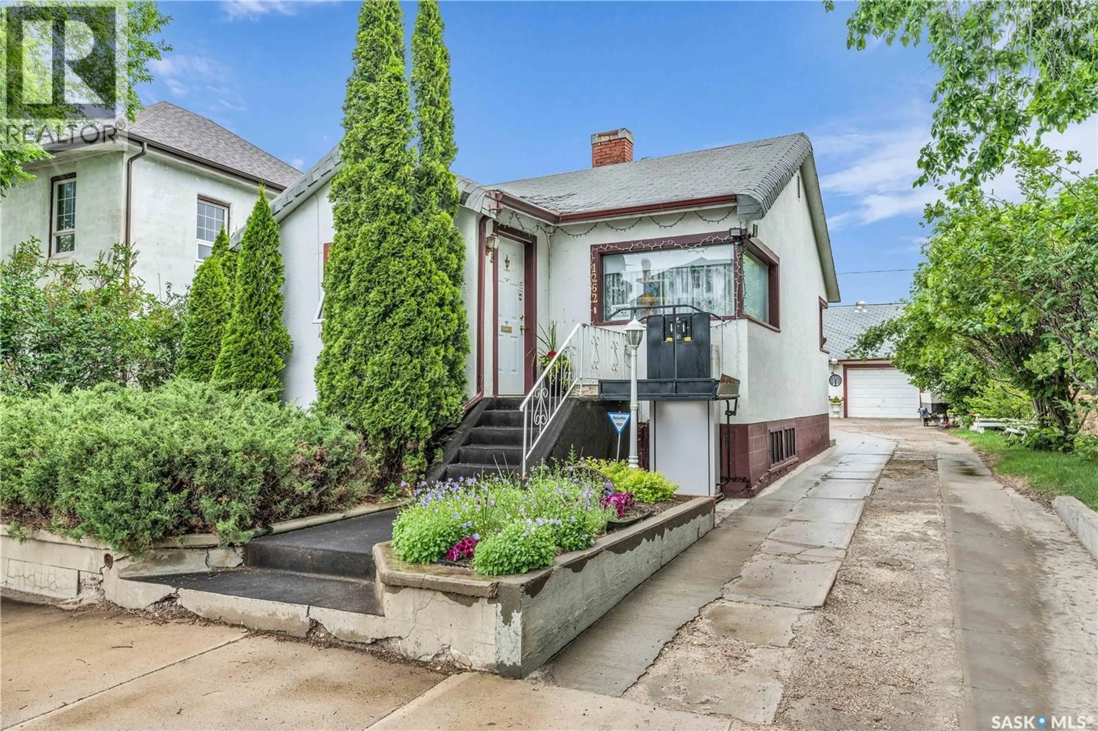 Home with brick exterior material, street for 1262 103RD STREET, North Battleford Saskatchewan S9A1K8