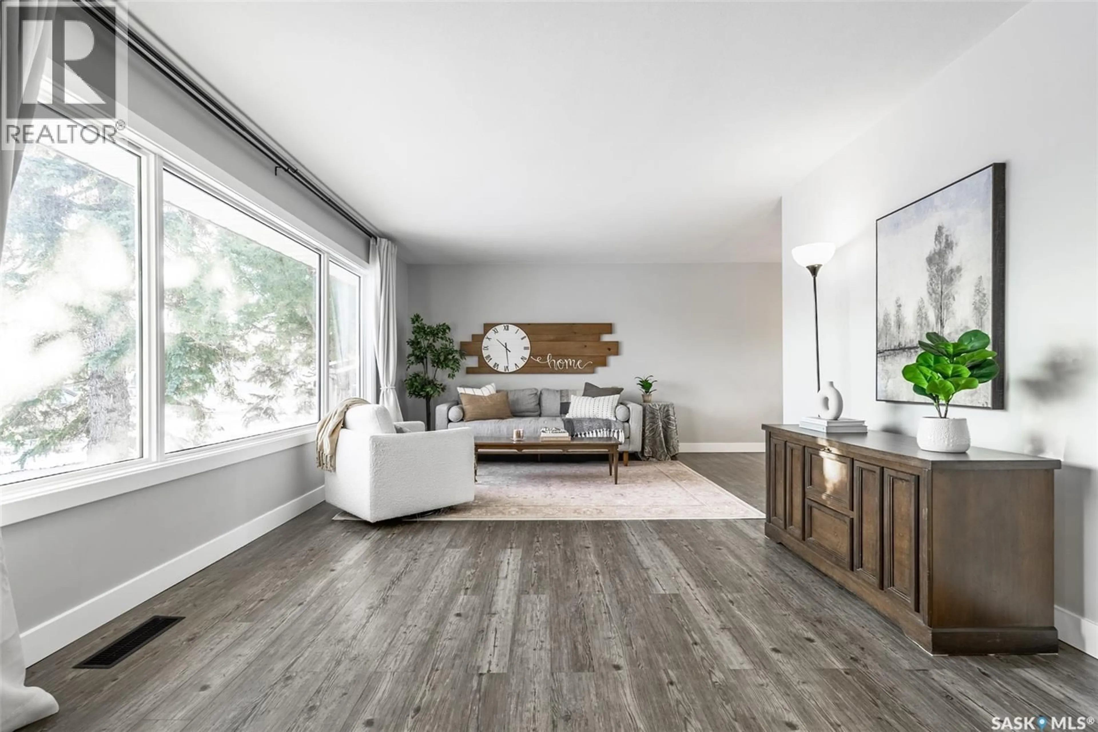 Living room with furniture, wood/laminate floor for 2616 HAULTAIN AVENUE, Saskatoon Saskatchewan S7J1R6