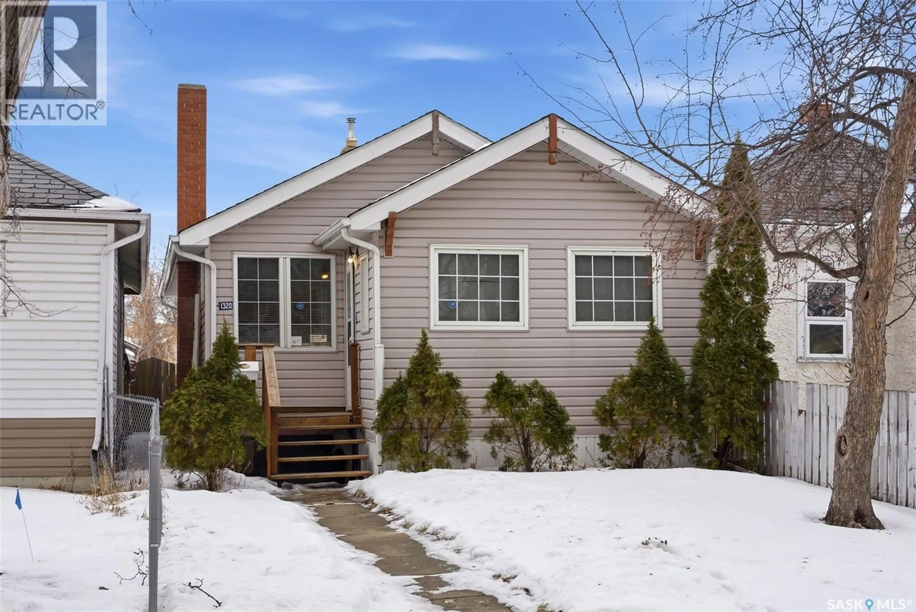 Home with vinyl exterior material, street for 1320 ATHOL STREET, Regina Saskatchewan S4T3C5