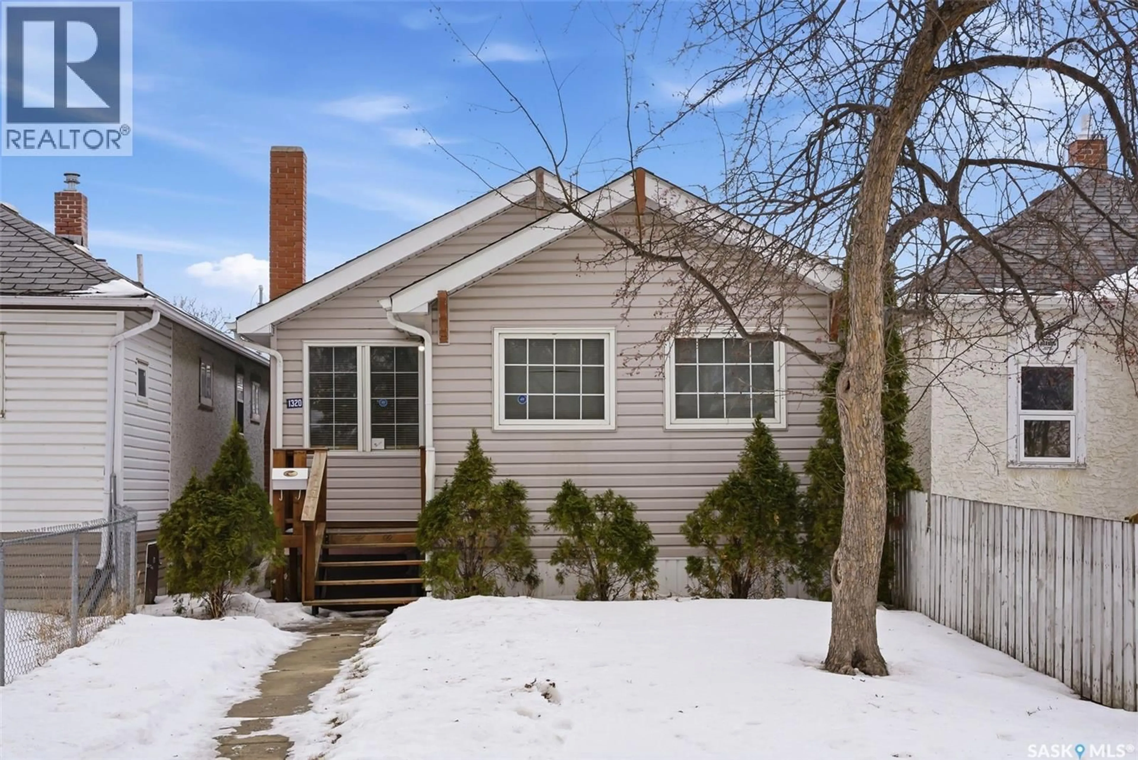 Home with vinyl exterior material, street for 1320 ATHOL STREET, Regina Saskatchewan S4T3C5