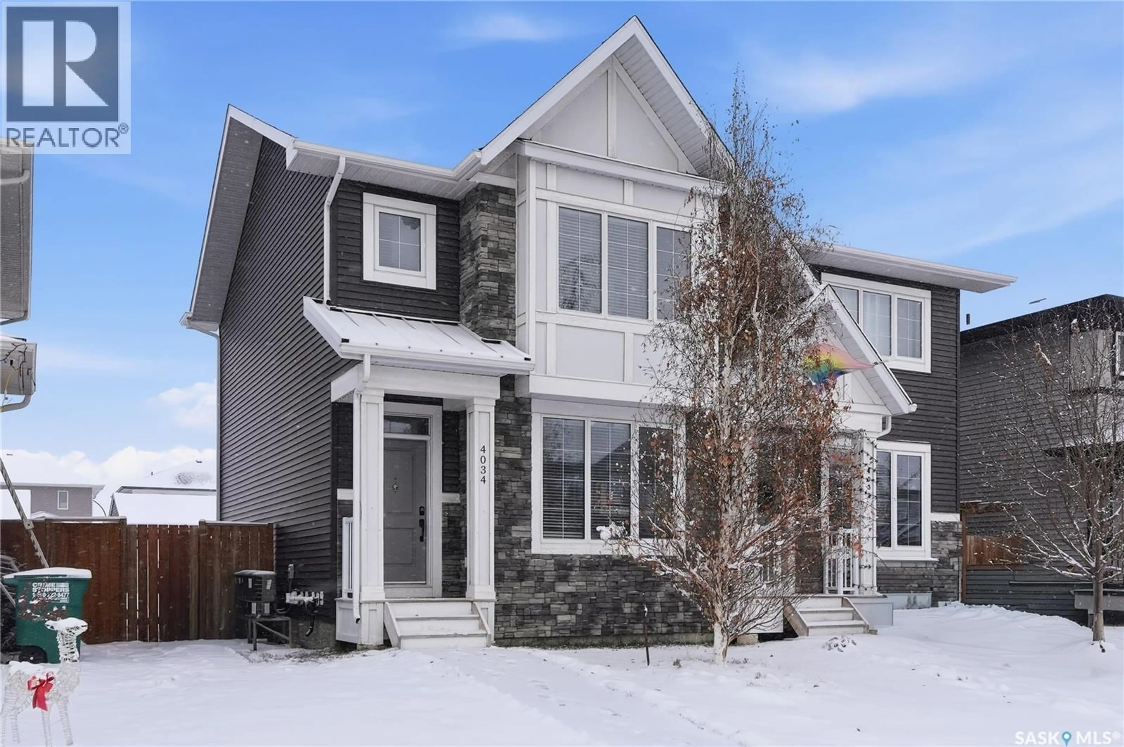 Home with brick exterior material, street for 4034 CENTENNIAL DRIVE, Saskatoon Saskatchewan S7L6R1