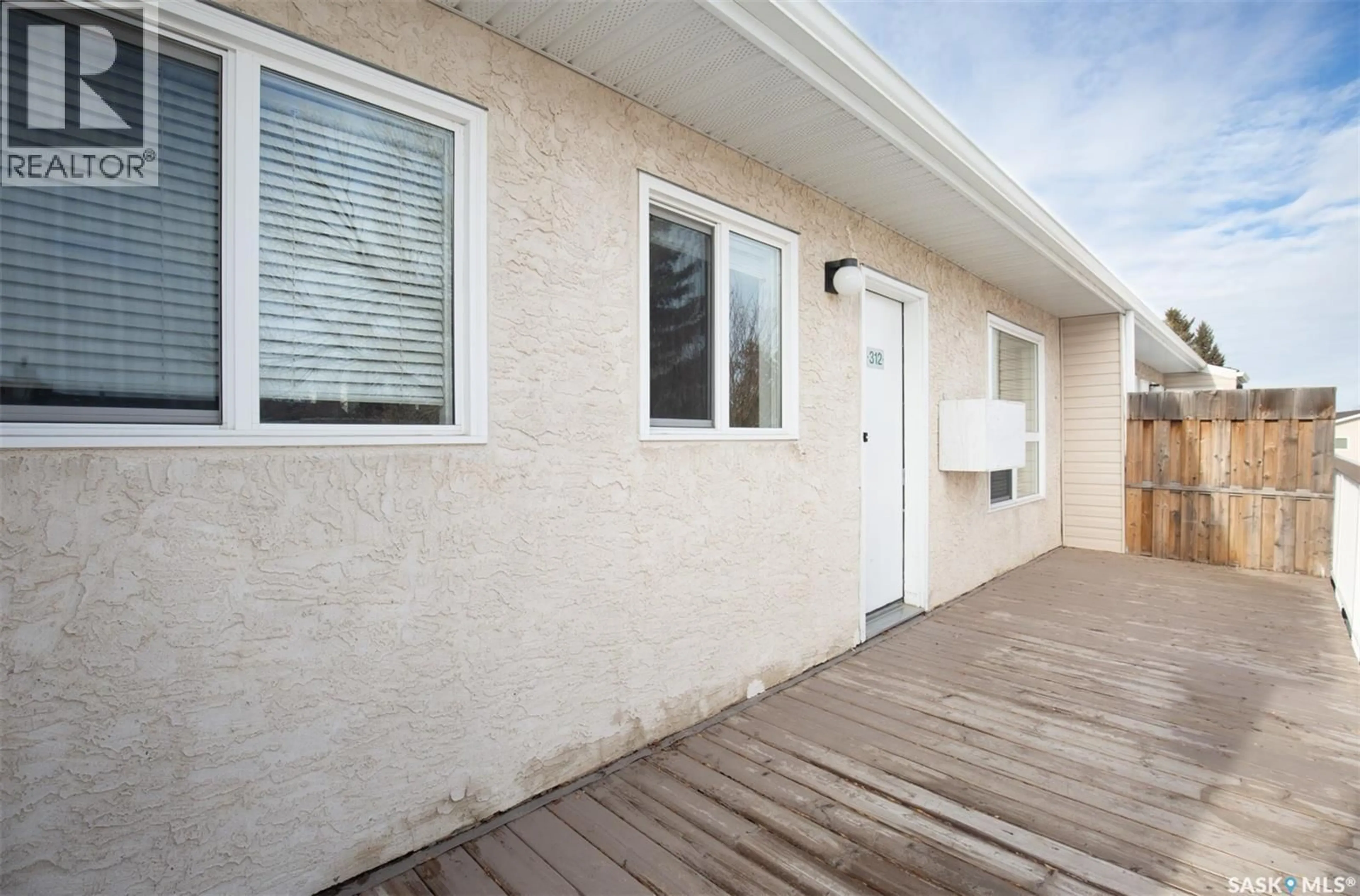 Home with vinyl exterior material, street for 67 - 312 WOOD LILY DRIVE, Moose Jaw Saskatchewan S6J1G6