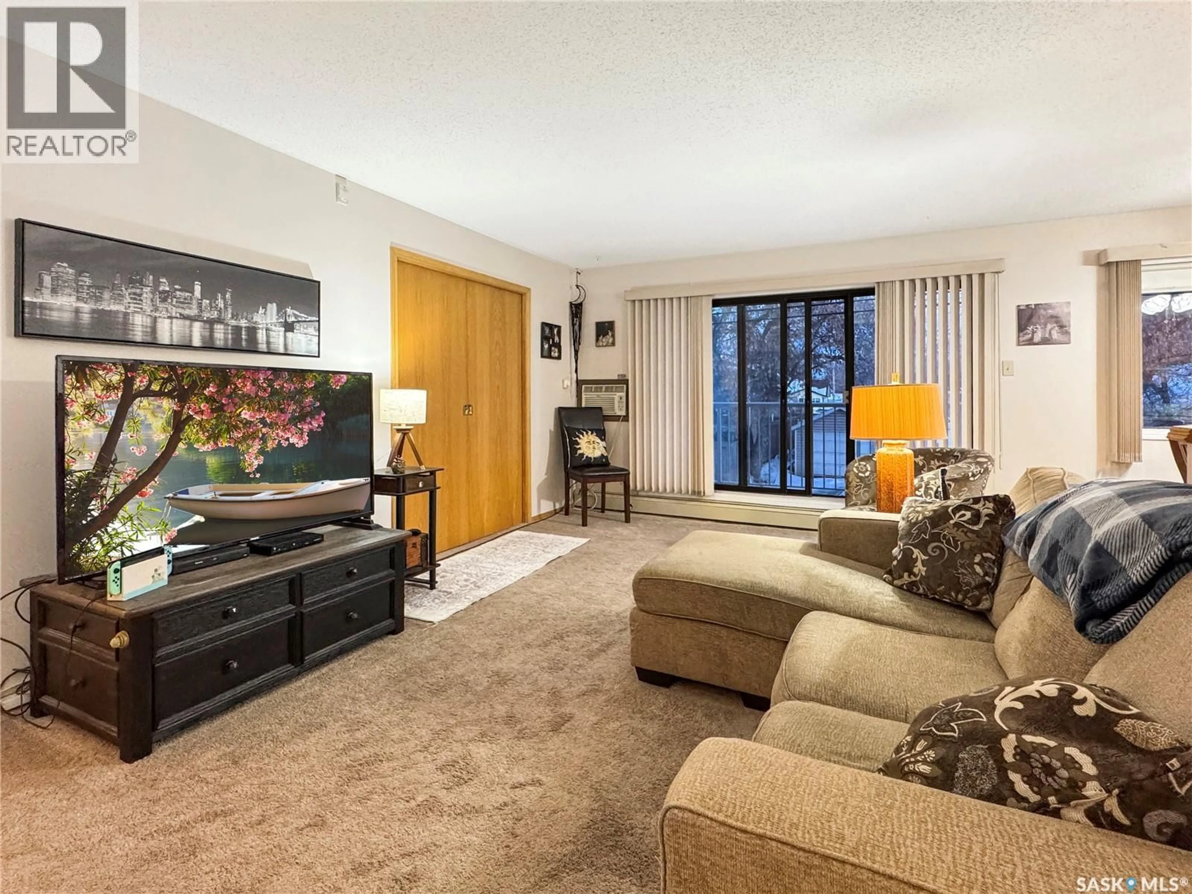 Living room with furniture, carpet floor for 102nd - 202 1442 STREET, North Battleford Saskatchewan S9A1G7