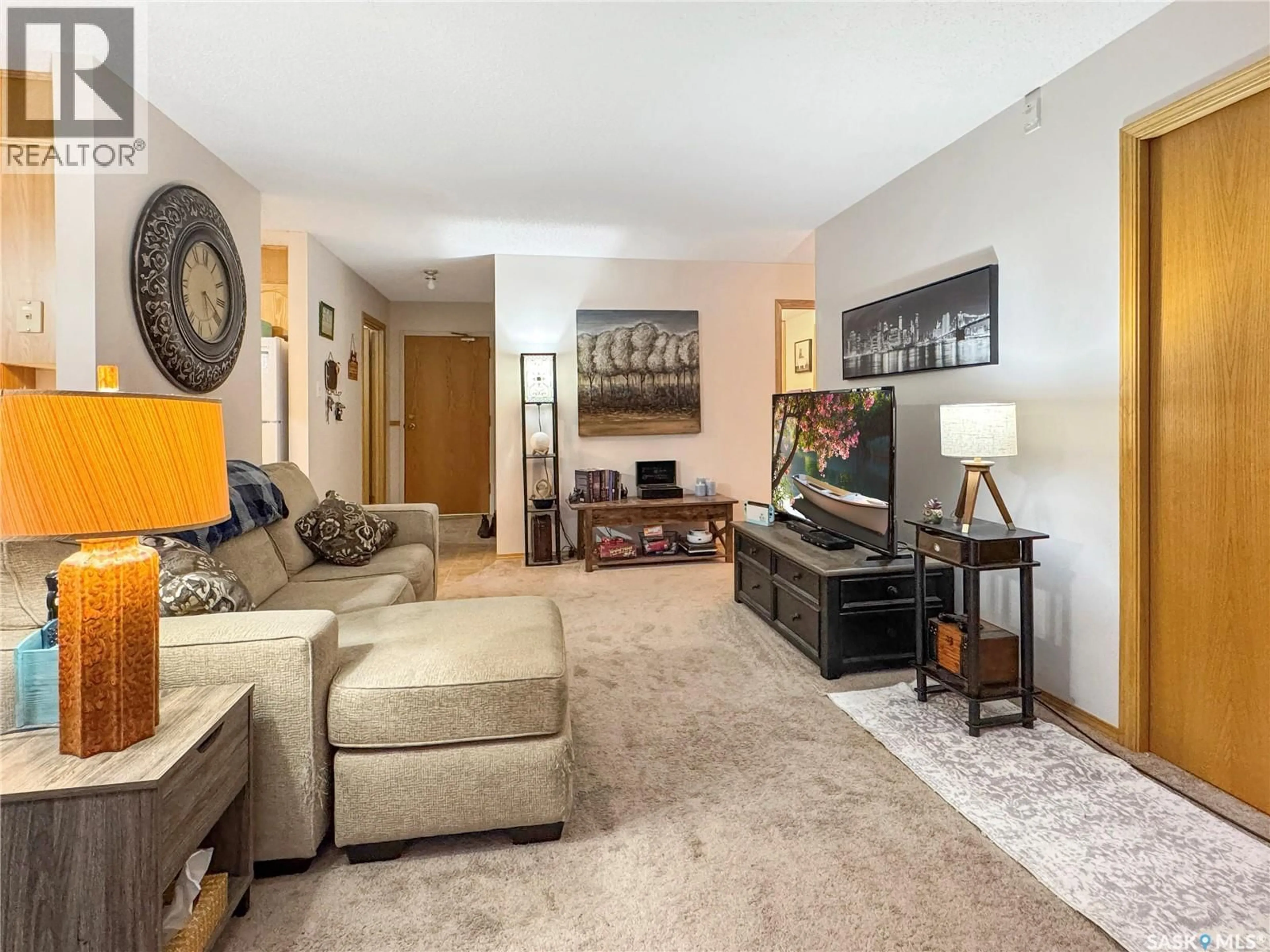 Living room with furniture, carpet floor for 102nd - 202 1442 STREET, North Battleford Saskatchewan S9A1G7