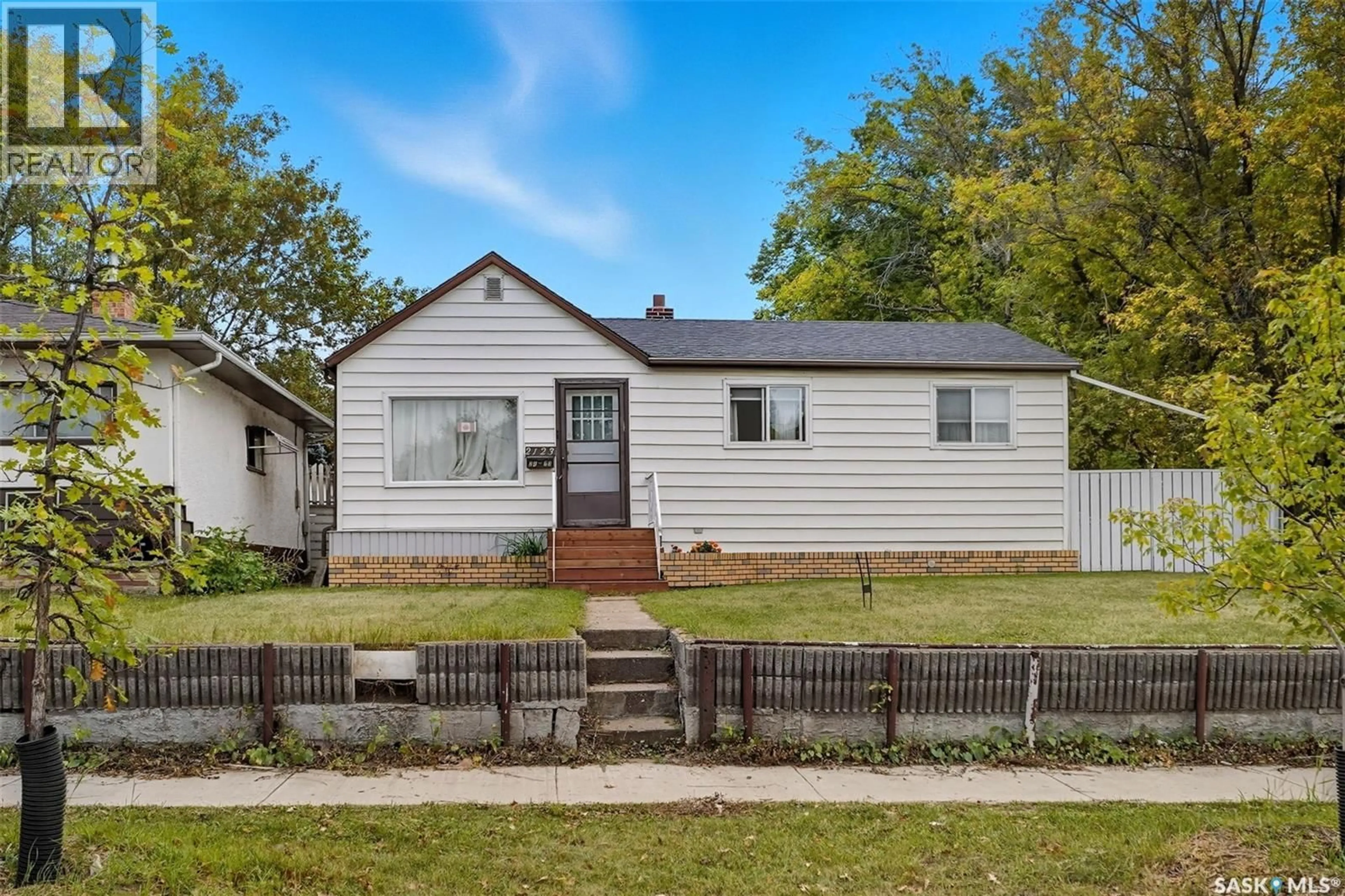 Home with vinyl exterior material, street for 2123 20TH STREET, Saskatoon Saskatchewan S7M1A7