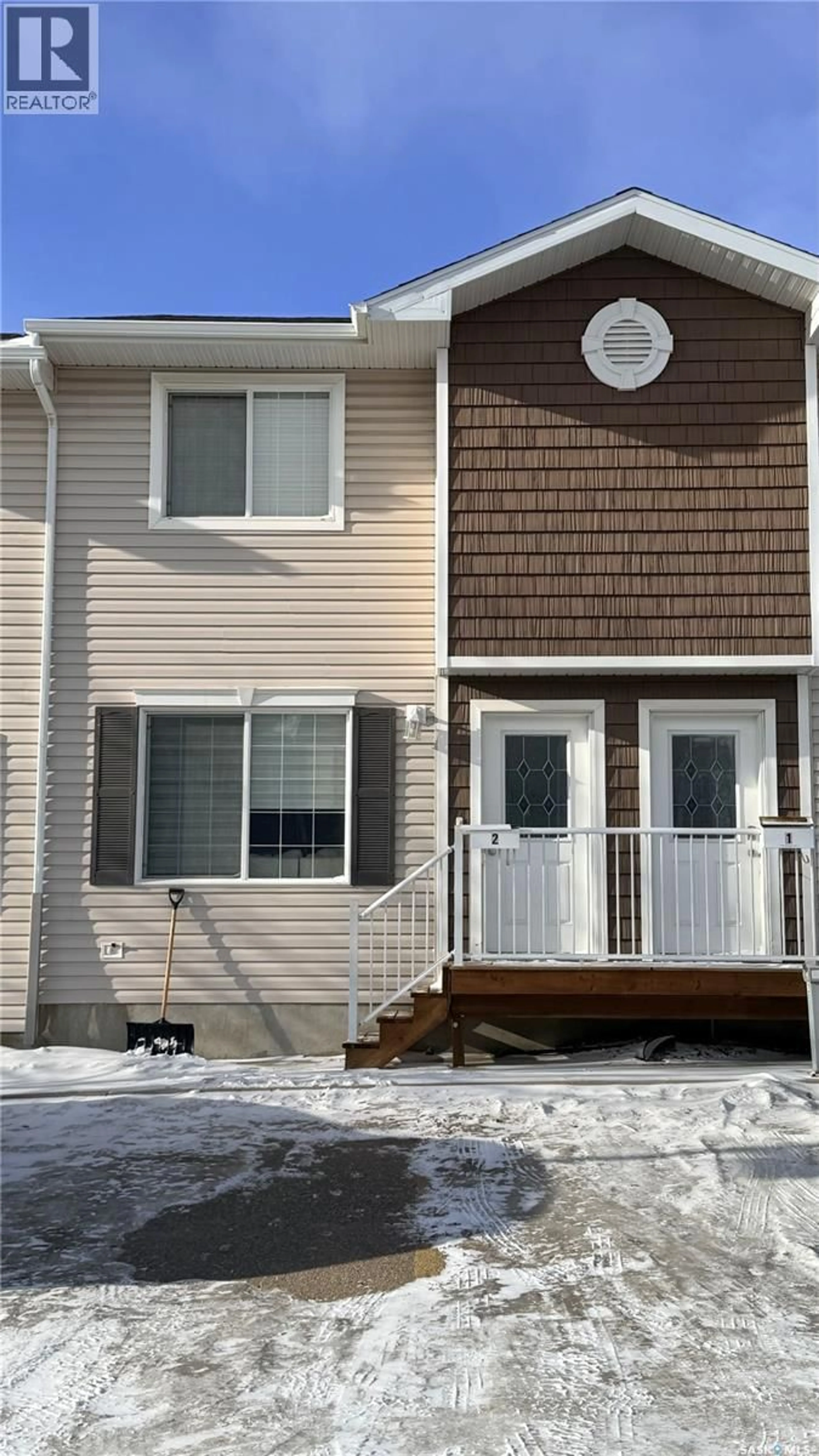 Home with vinyl exterior material, street for 2 - 1621 FIRST STREET, Estevan Saskatchewan S4A2X4