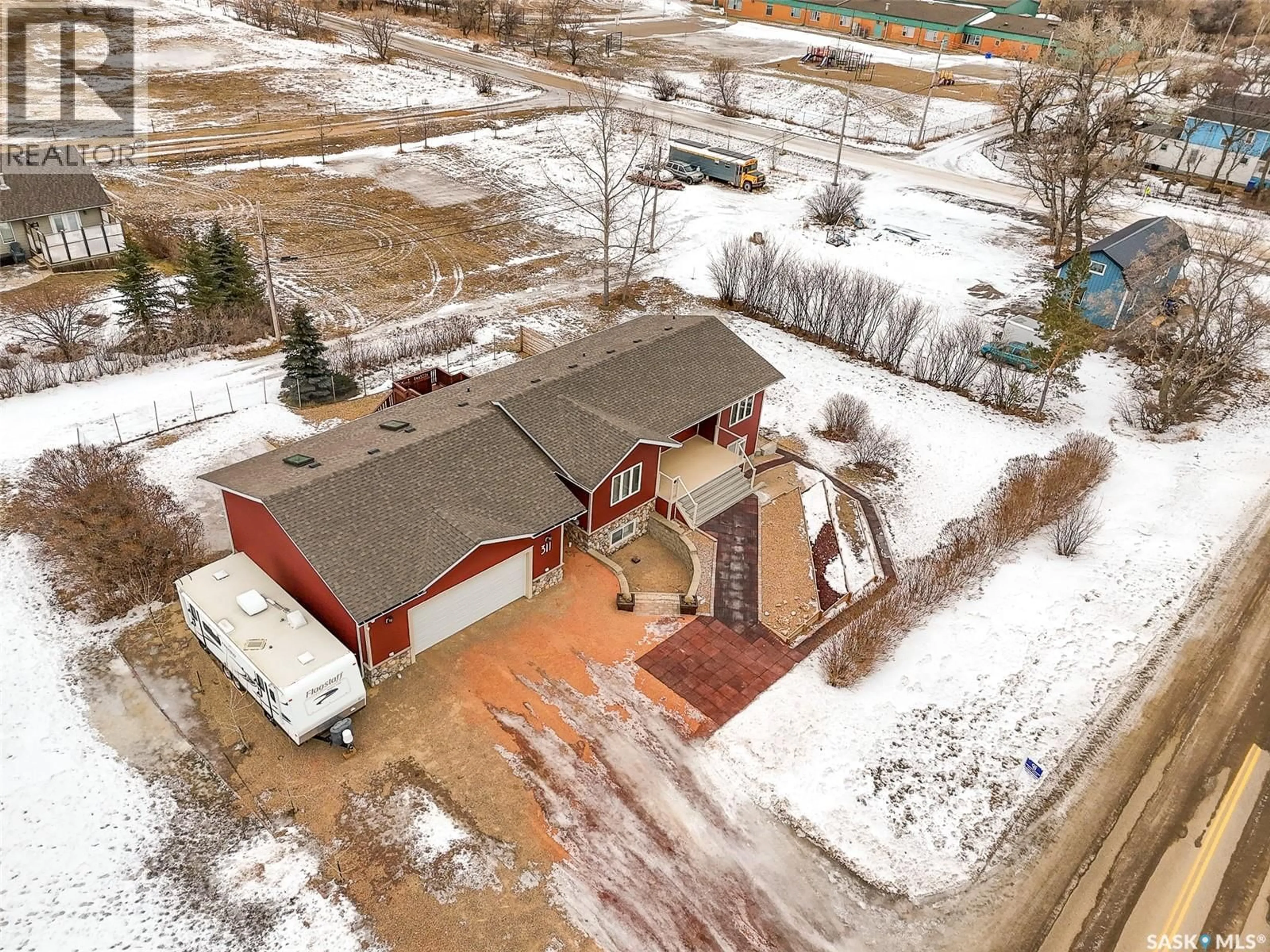A pic from outside/outdoor area/front of a property/back of a property/a pic from drone, building for 311 ROSE STREET, Mortlach Saskatchewan S0H3E0