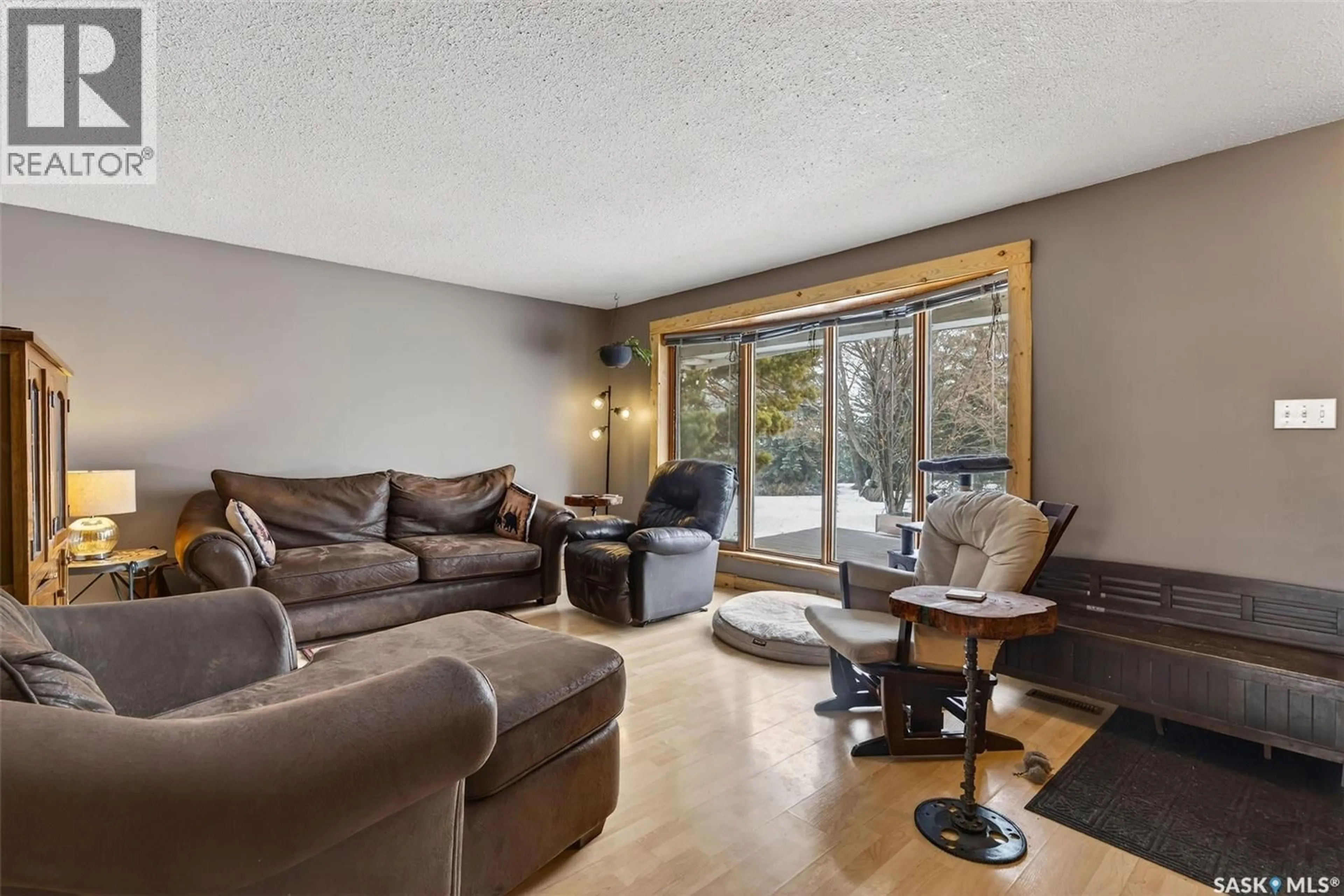 Living room with furniture, wood/laminate floor for REEDER ACREAGE, Prince Albert Rm No. 461 Saskatchewan S6V5R1