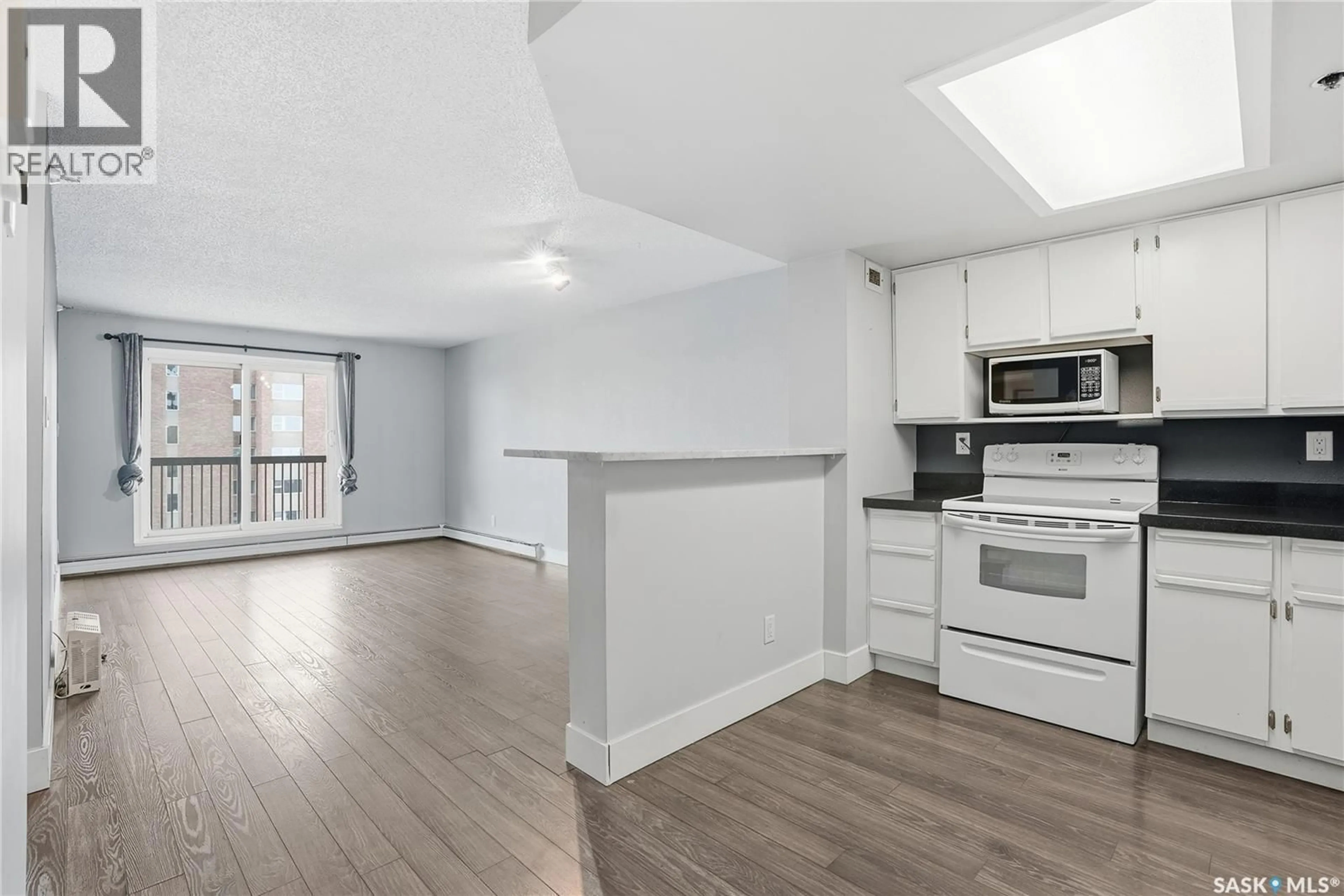 Open concept kitchen, wood/laminate floor for N - 905 311 6TH AVENUE, Saskatoon Saskatchewan S7K7A9