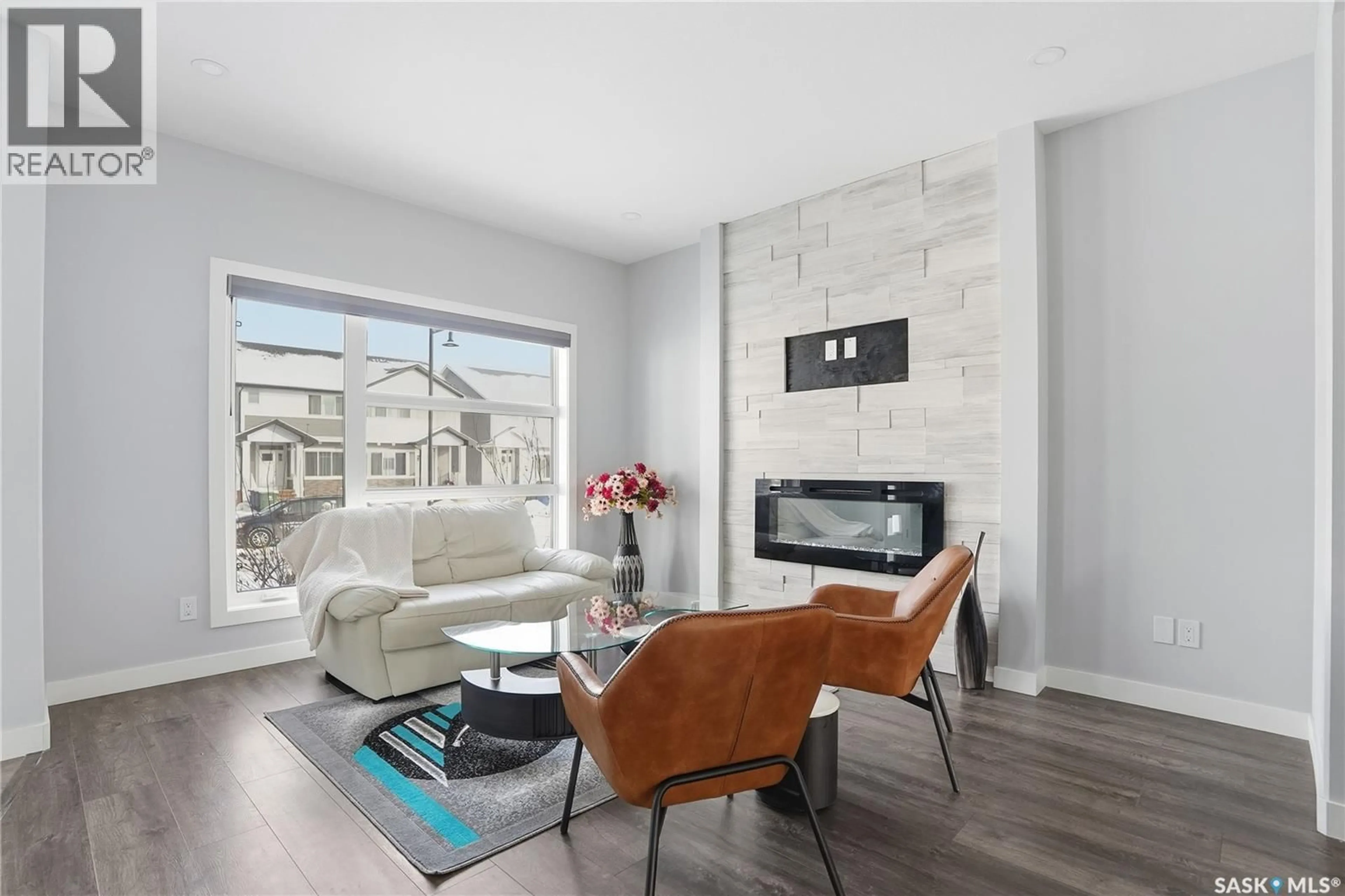Living room with furniture, ceramic/tile floor for 306 BRIGHTON BOULEVARD, Saskatoon Saskatchewan S7V0V8
