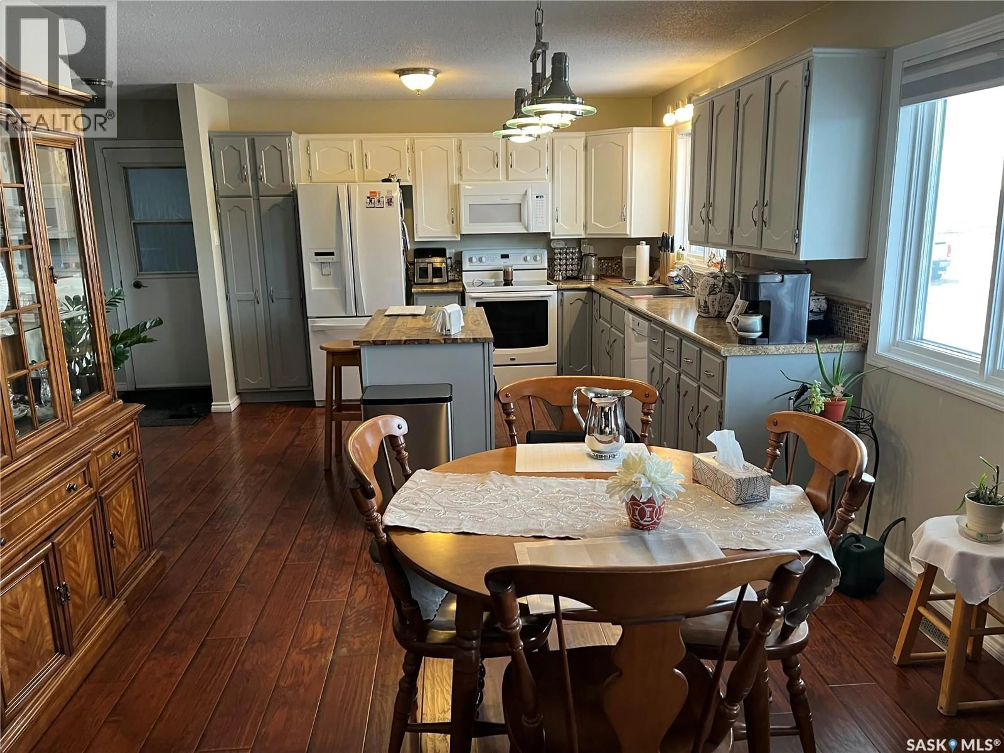 Open concept kitchen, wood/laminate floor for 108 7TH AVENUE, Lafleche Saskatchewan S0H2K0