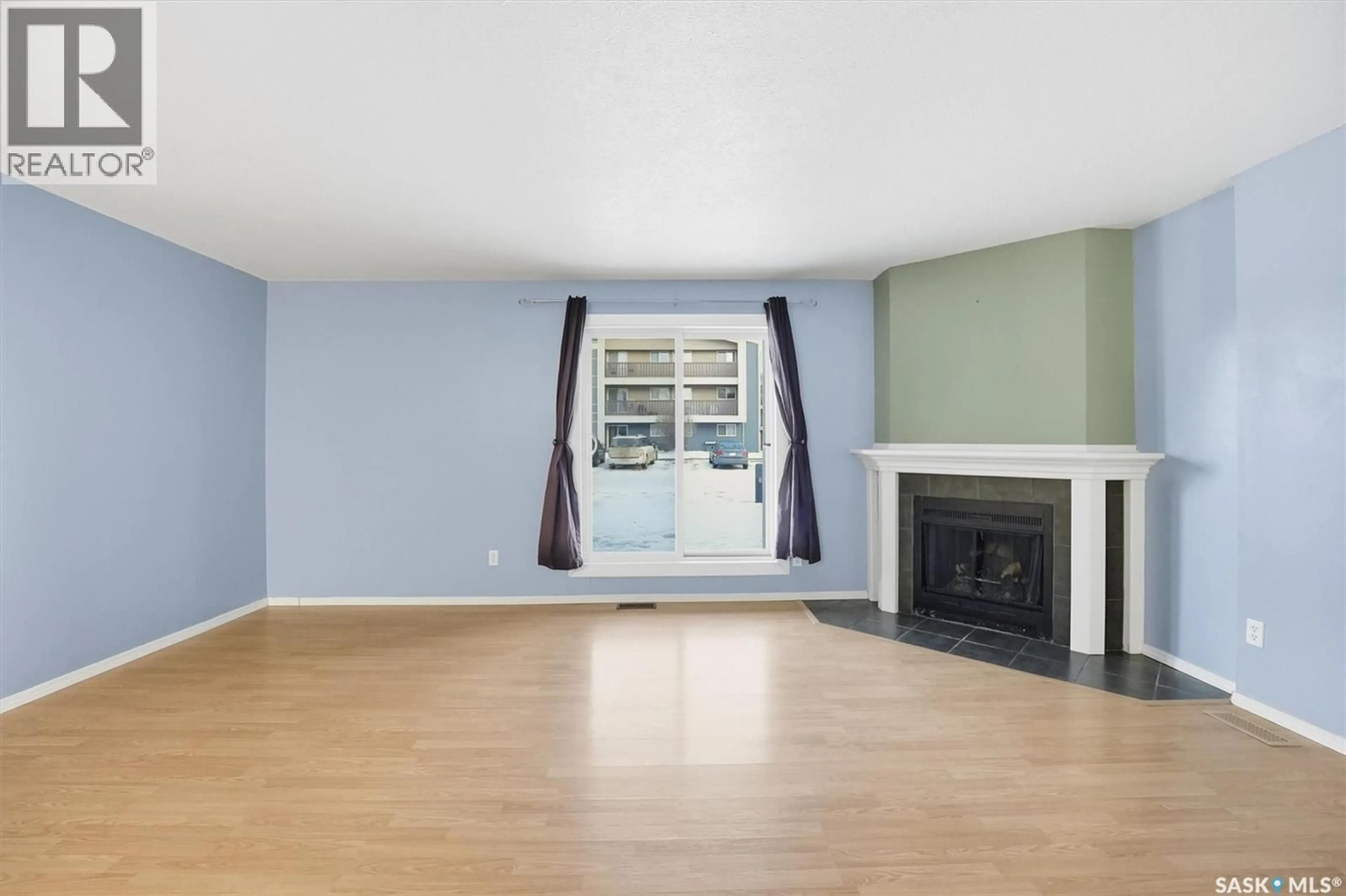 Living room with furniture, wood/laminate floor for 510 - 316 PRAIRIE AVENUE, Saskatoon Saskatchewan S7N2V4