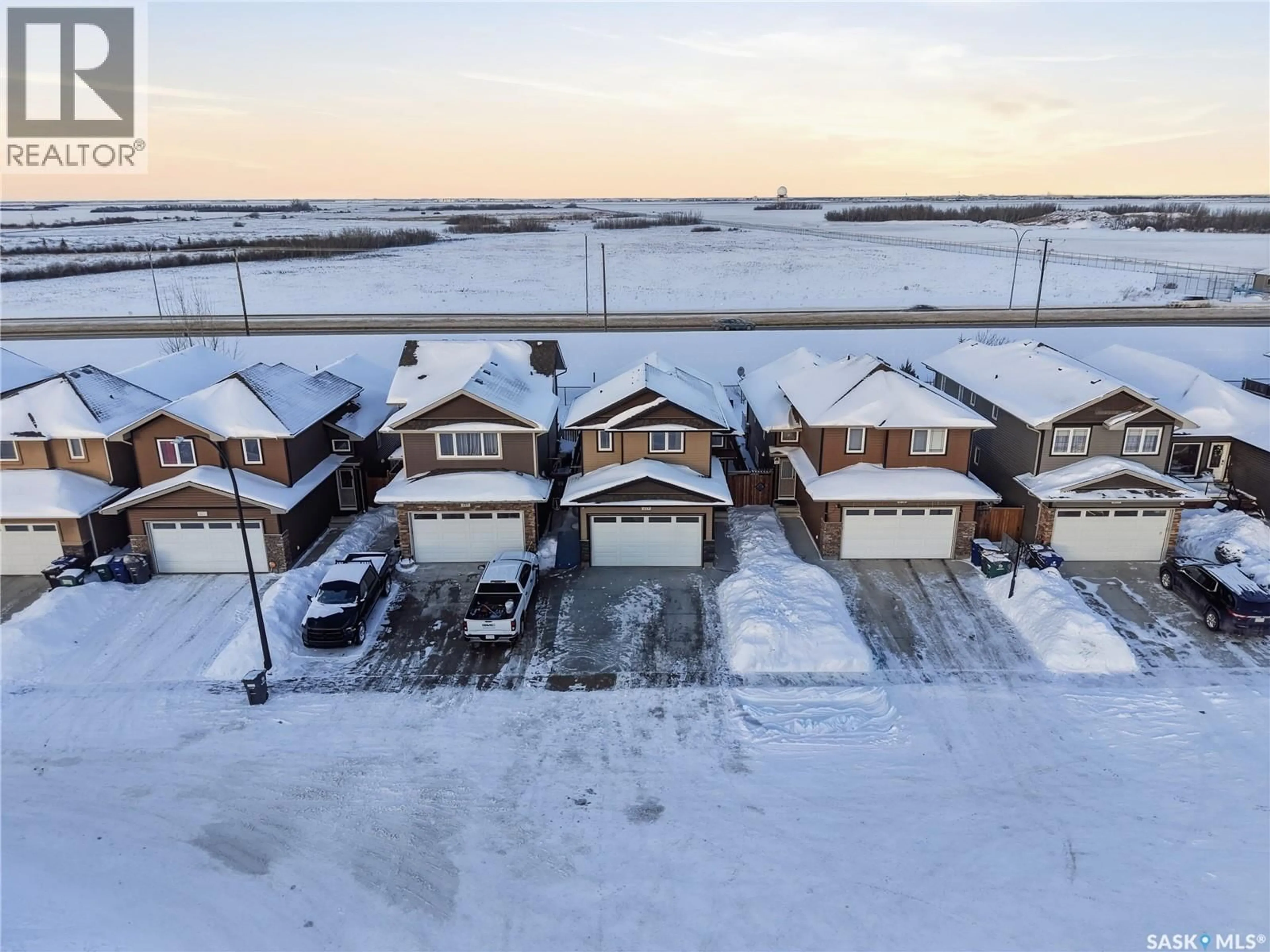 A pic from outside/outdoor area/front of a property/back of a property/a pic from drone, unknown for 219 HENICK CRESCENT, Saskatoon Saskatchewan S7H0J9