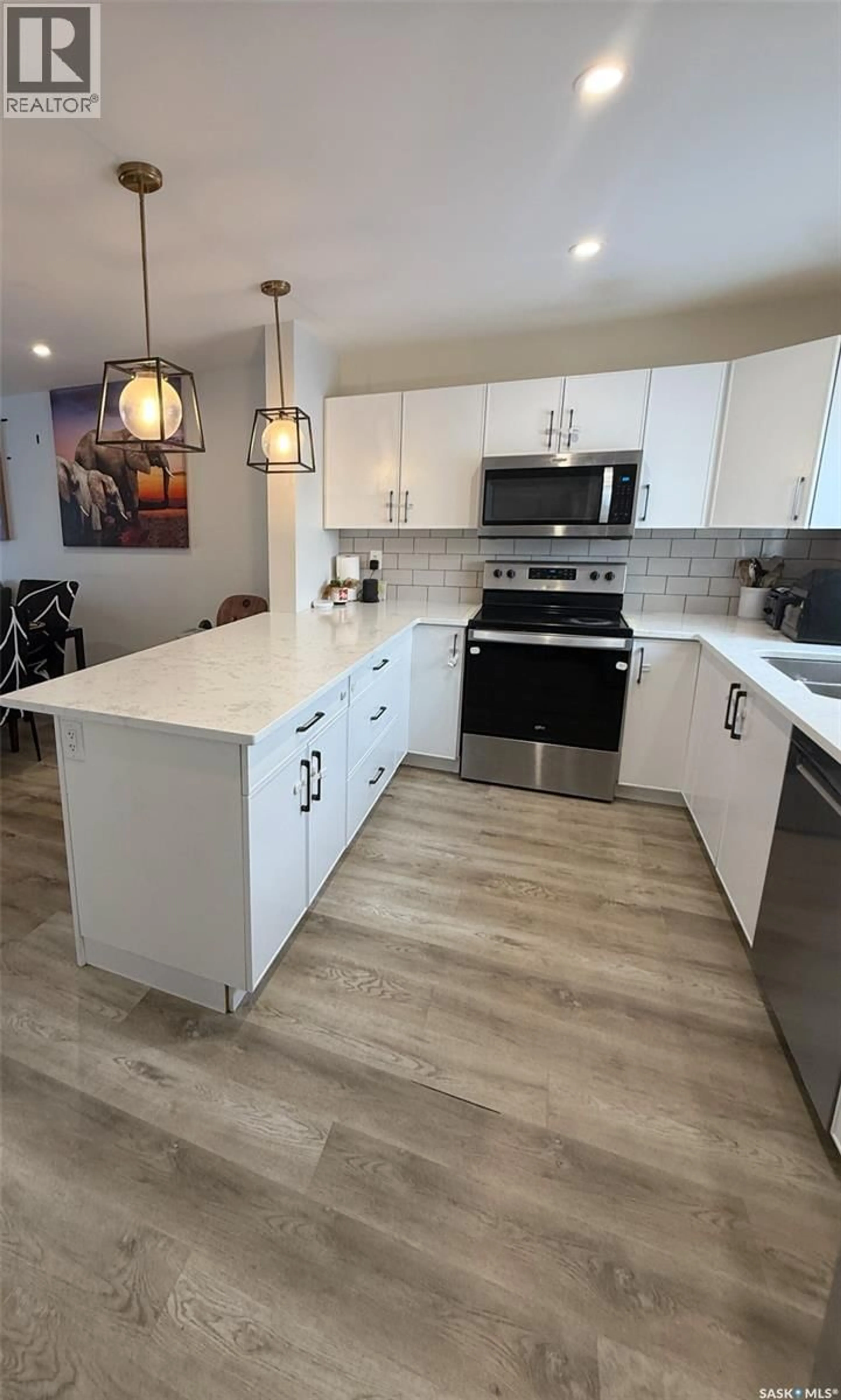 Open concept kitchen, ceramic/tile floor for 104 WESTFIELD ROAD, Saskatoon Saskatchewan S7V0Z8