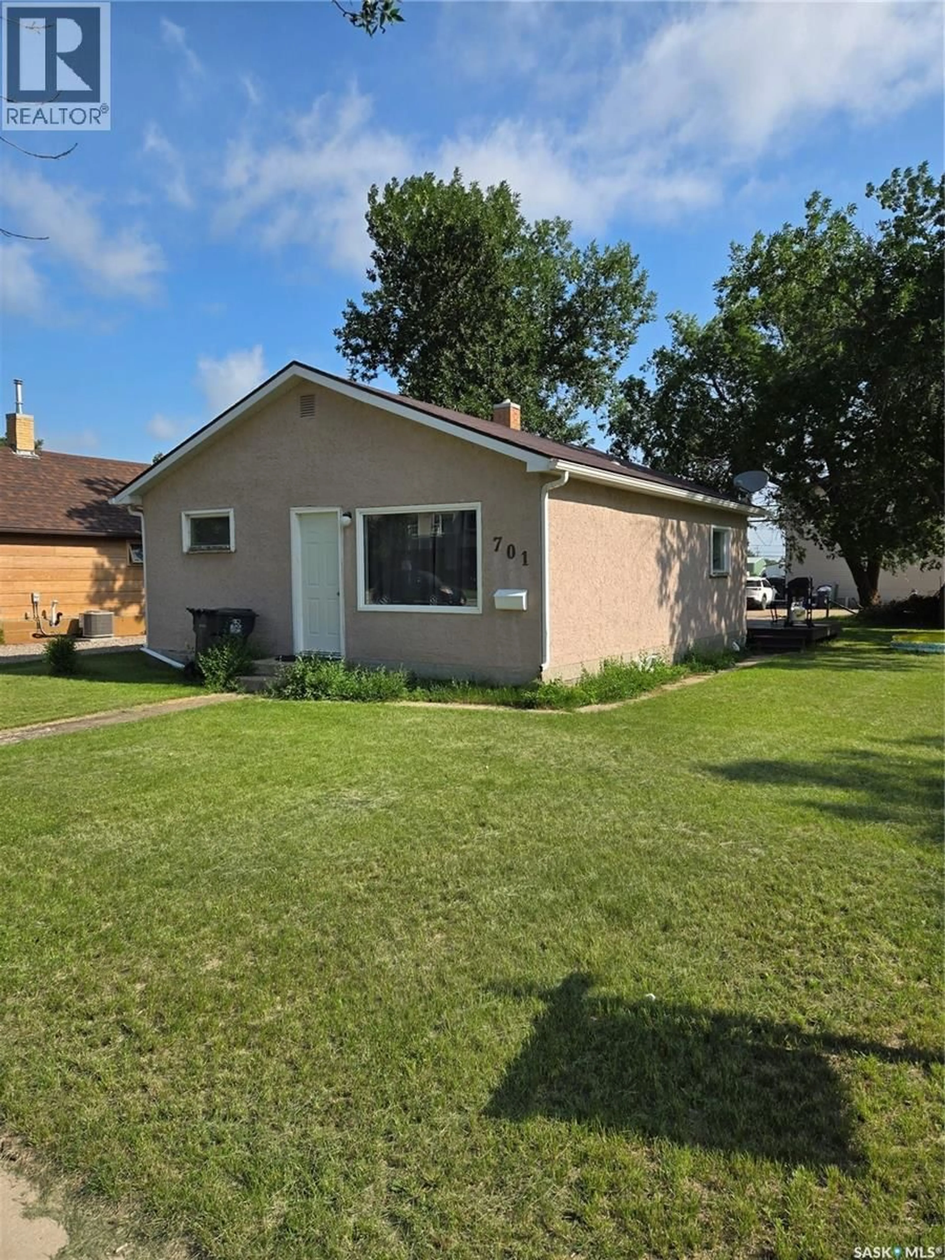 Home with vinyl exterior material, street for 701 3RD STREET, Estevan Saskatchewan S4A0P7