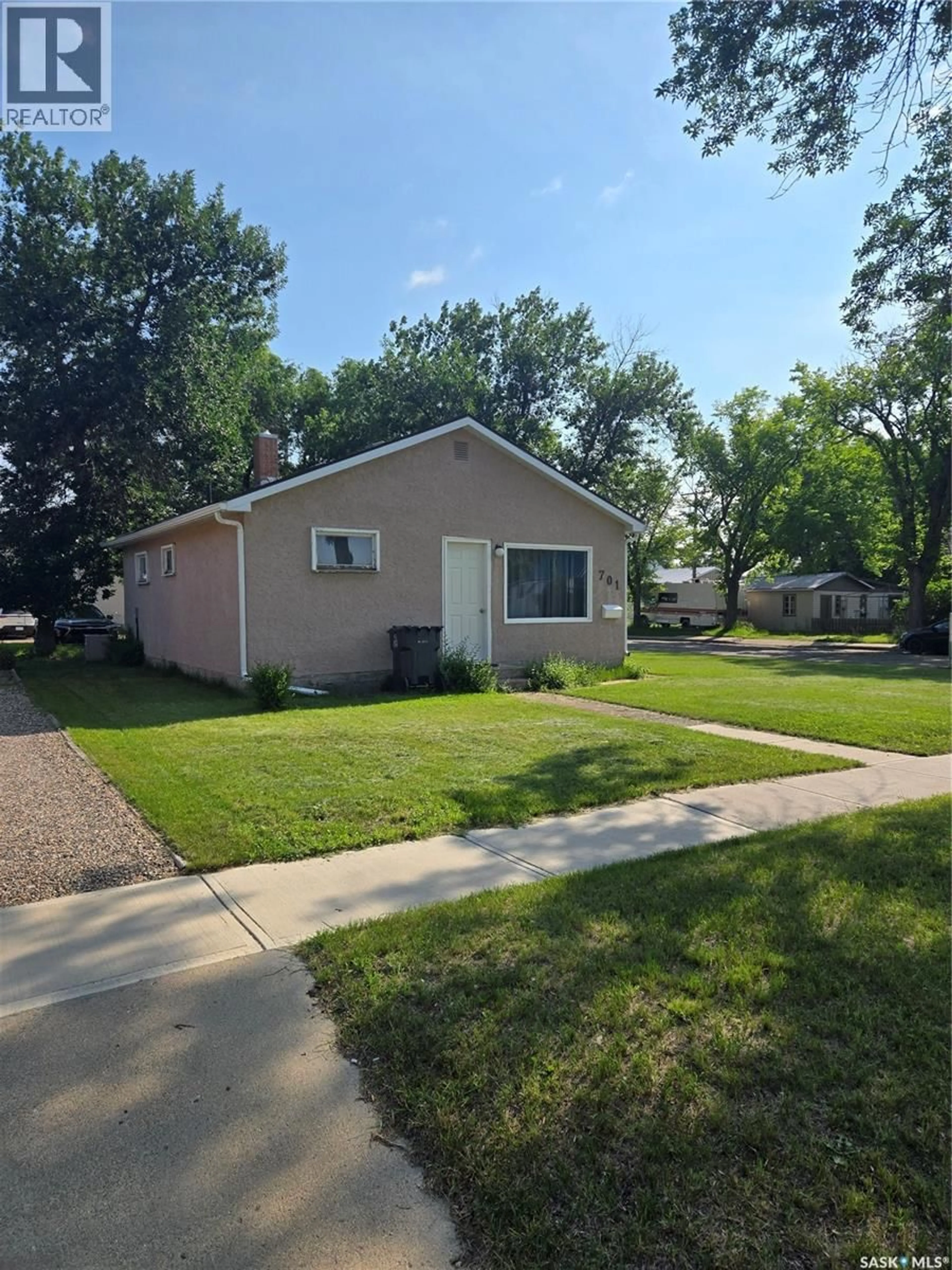 Home with vinyl exterior material, street for 701 3RD STREET, Estevan Saskatchewan S4A0P7