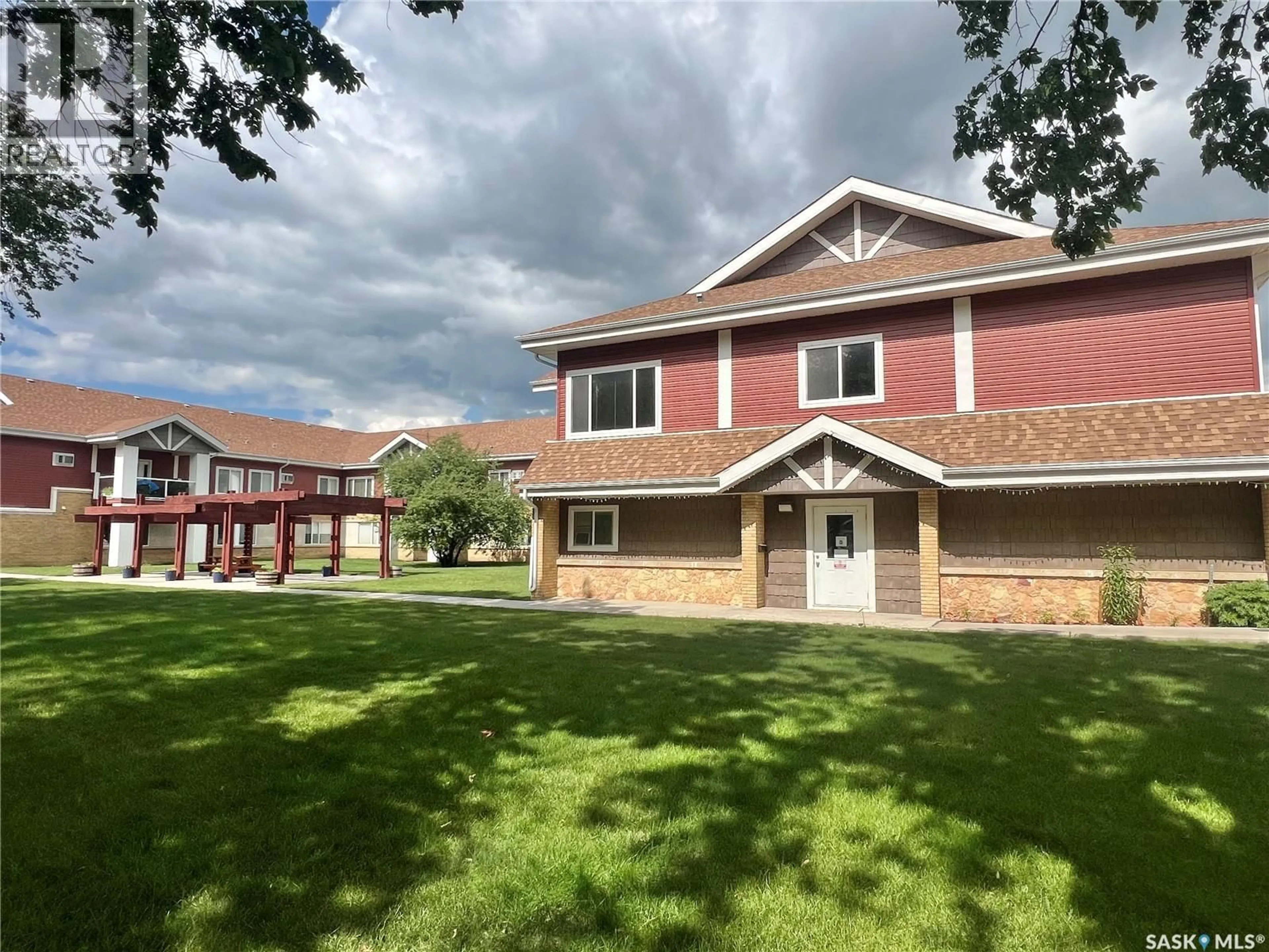 A pic from outside/outdoor area/front of a property/back of a property/a pic from drone, building for 302 - 101 BEMISTER AVENUE E, Melfort Saskatchewan S0E1A0
