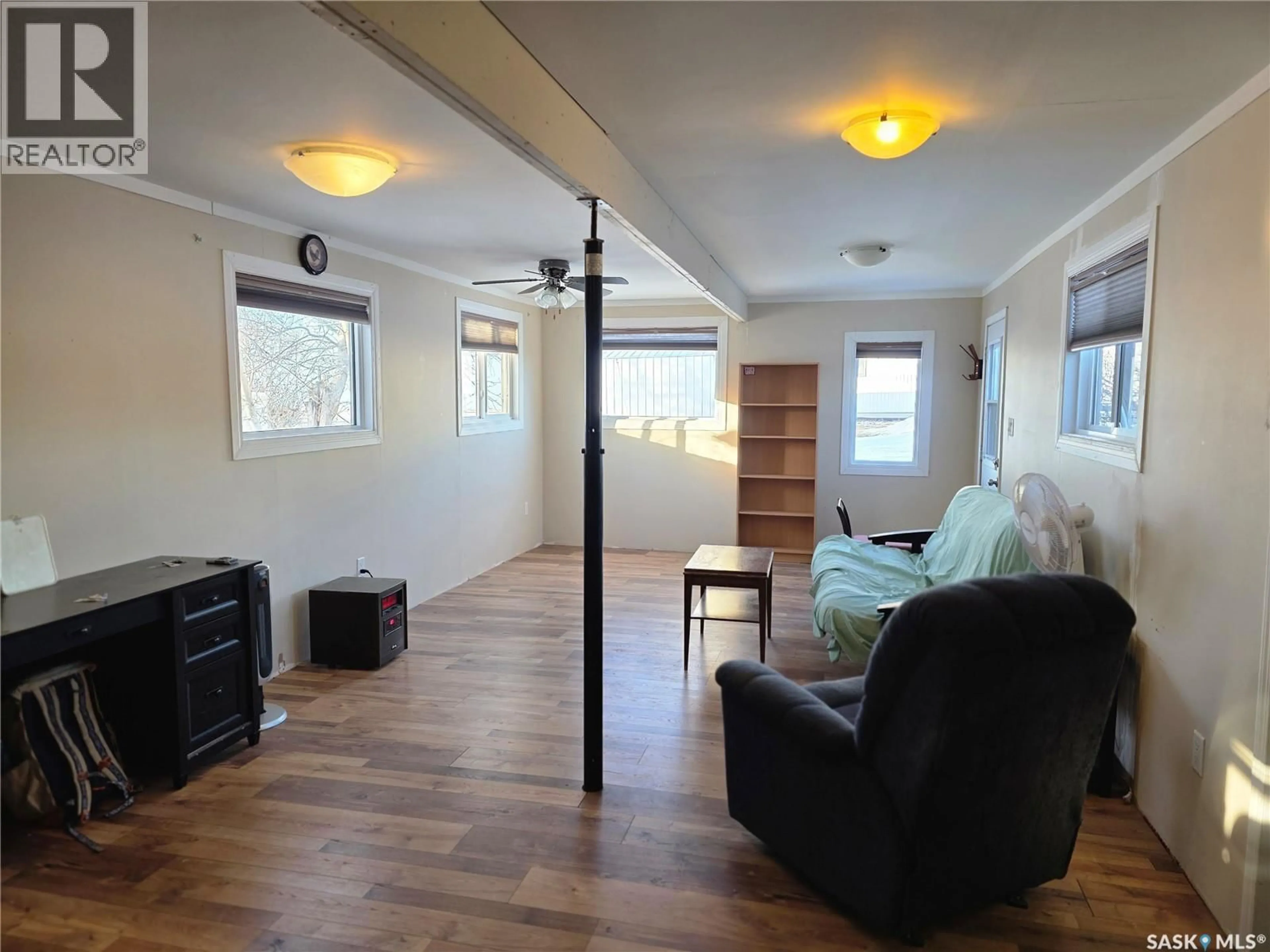 Living room with furniture, wood/laminate floor for 792 SASKATCHEWAN AVENUE, Milden Saskatchewan S0L2L0