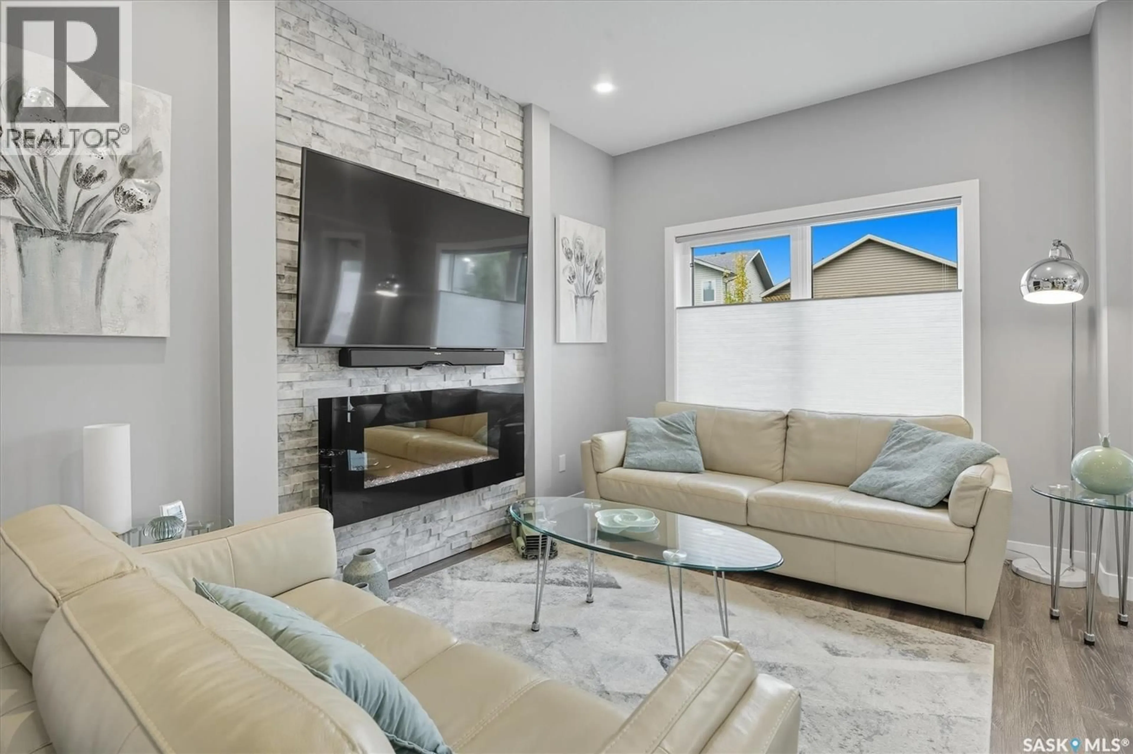 Living room with furniture, ceramic/tile floor for 242 BRIGHTON GATE, Saskatoon Saskatchewan S7V0R1