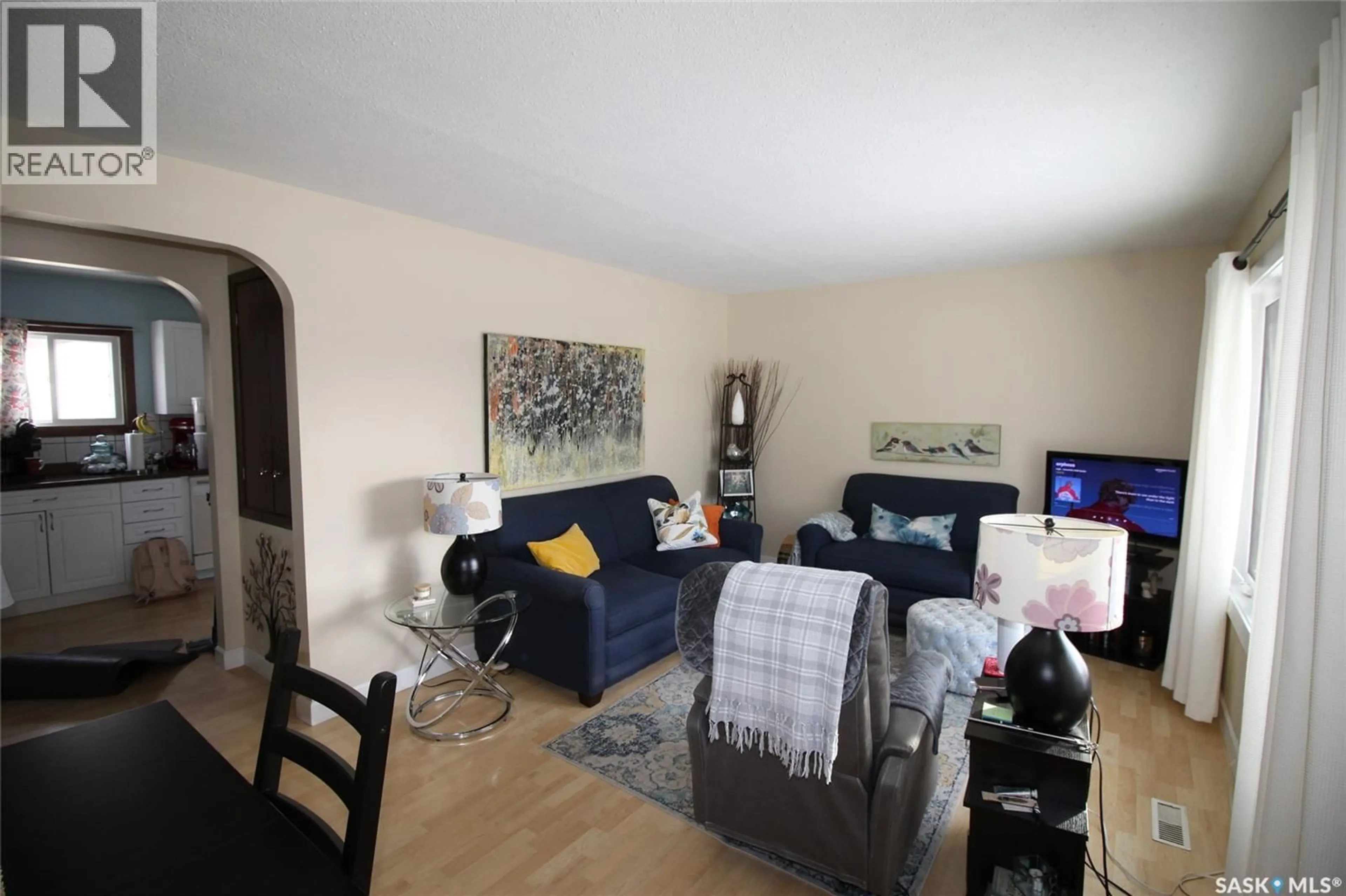 Living room with furniture, wood/laminate floor for 644 1ST STREET, Shaunavon Saskatchewan S0N2M0