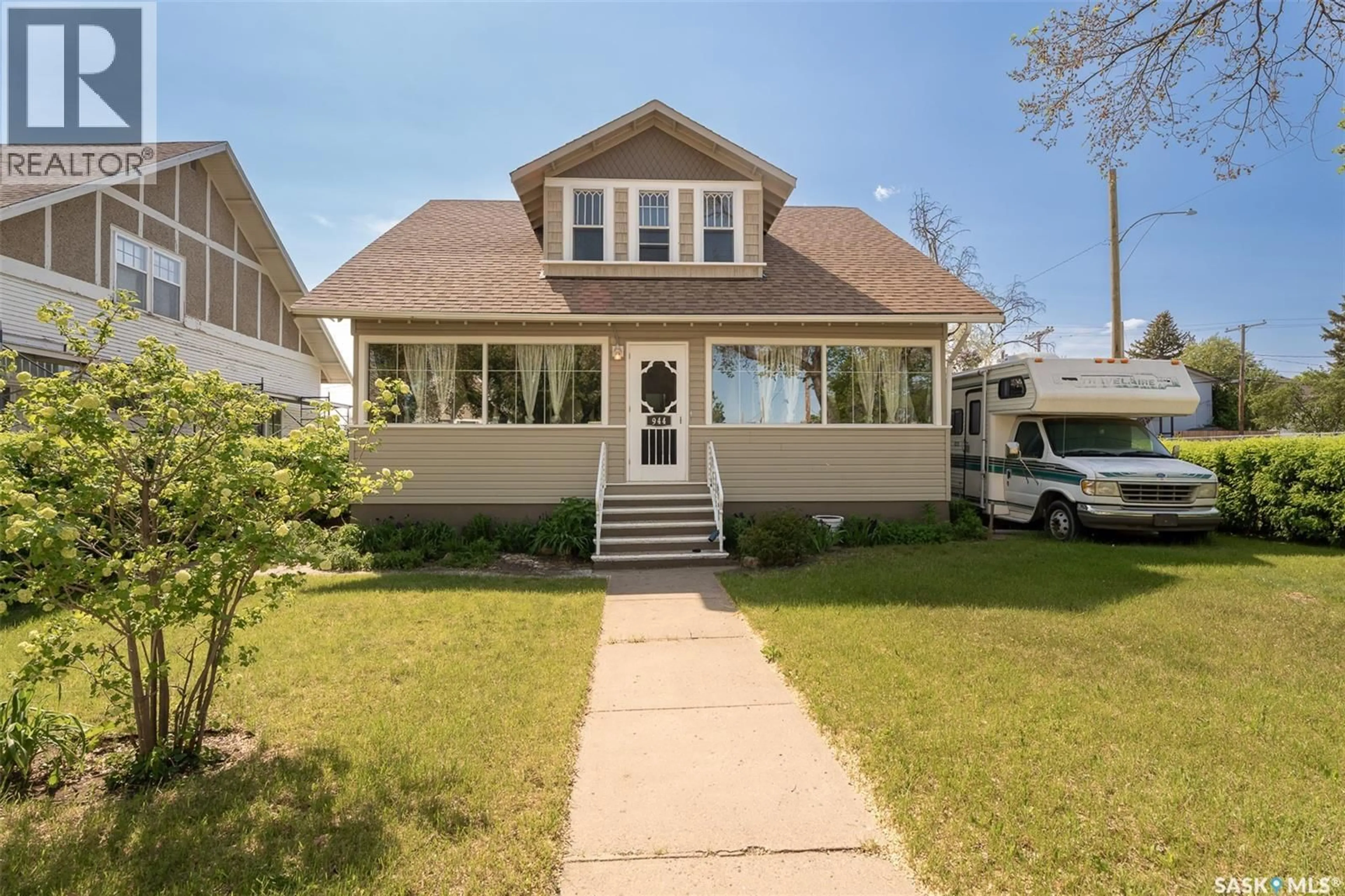 Home with vinyl exterior material, street for 944 ALDER AVENUE, Moose Jaw Saskatchewan S6H0Y1