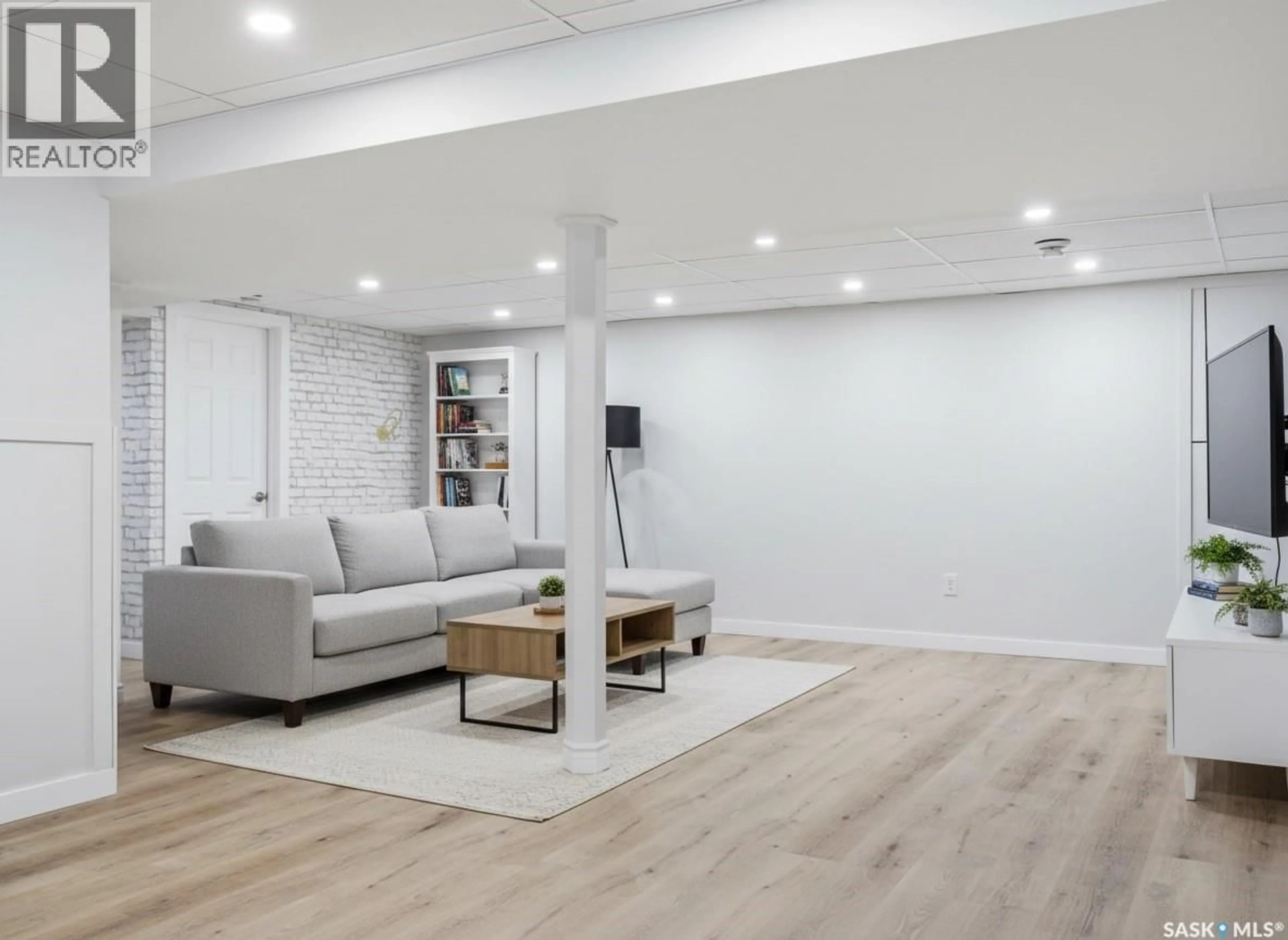 Living room with furniture, wood/laminate floor for 158 BENTLEY DRIVE, Regina Saskatchewan S4N4S6