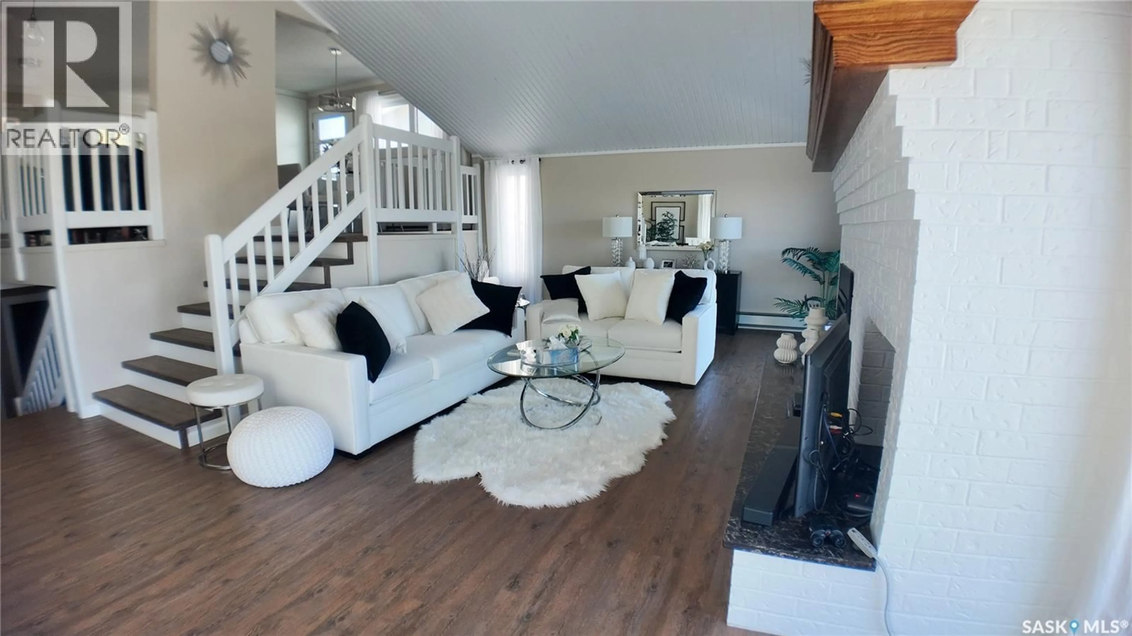 Living room with furniture, wood/laminate floor for 6 1ST AVENUE, Battleford Saskatchewan S0M0E0