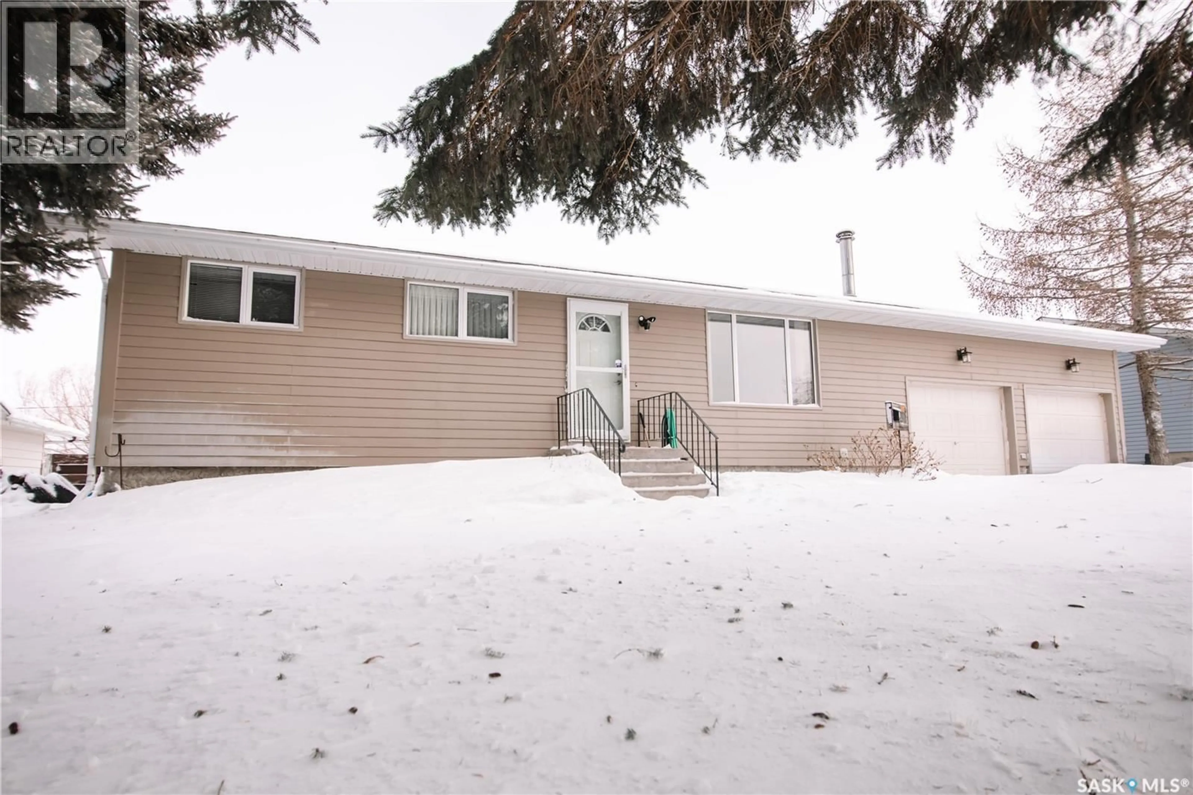 Home with vinyl exterior material, street for 409 3RD STREET, Pilot Butte Saskatchewan S0G3Z0