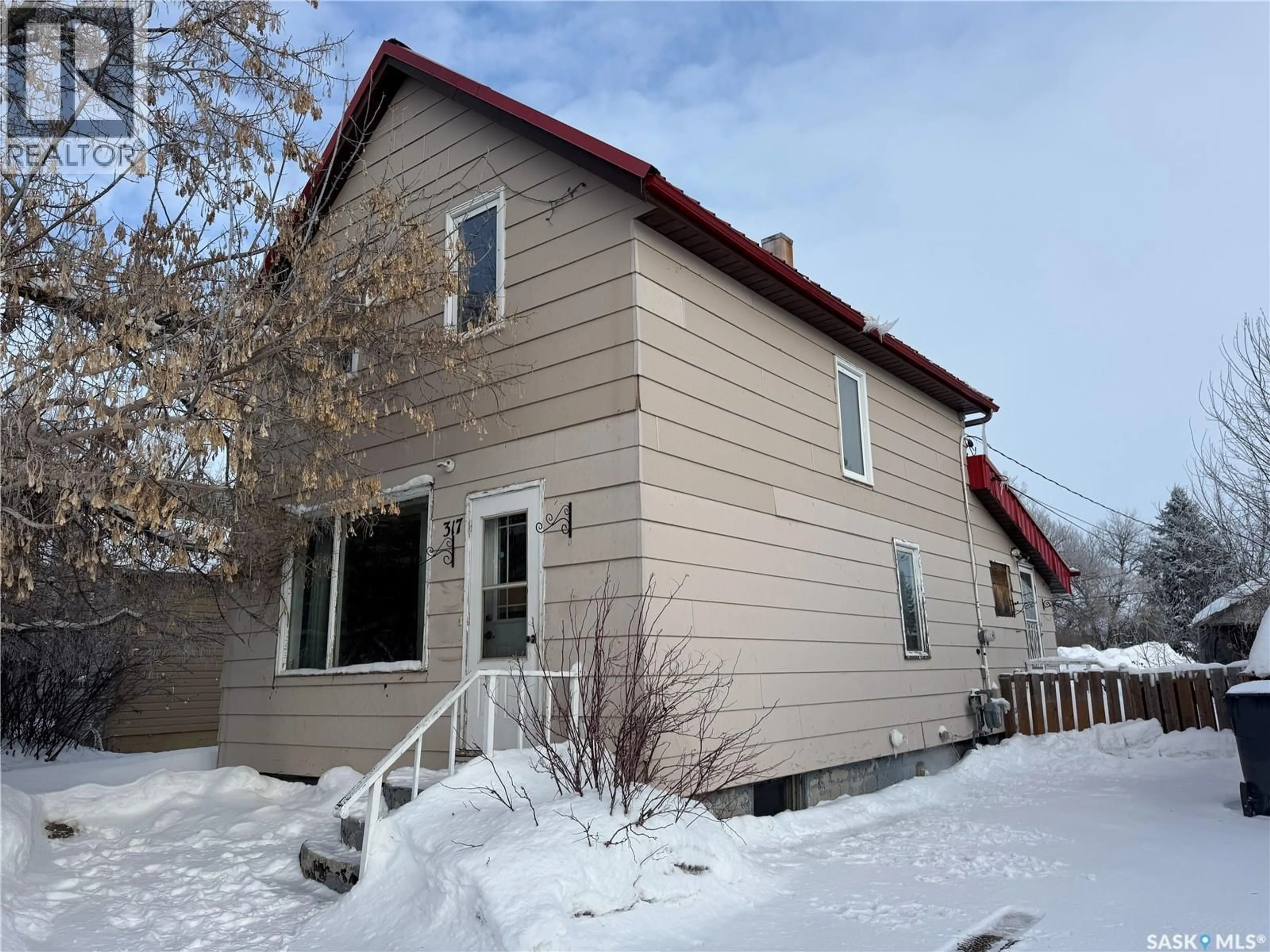 Home with vinyl exterior material, street for 317 MOORE STREET, Foam Lake Saskatchewan S0A1A0