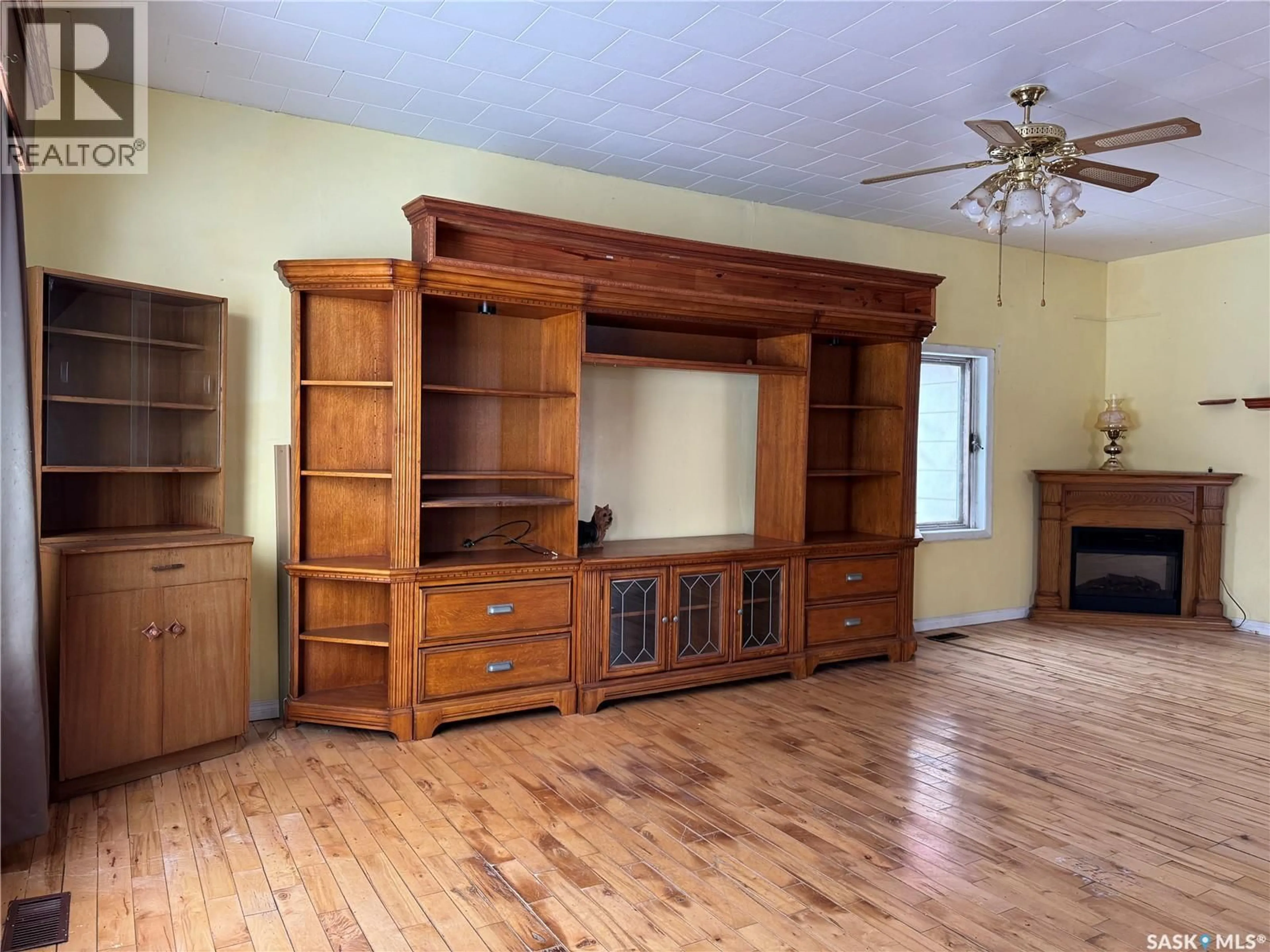 Living room with furniture, wood/laminate floor for 317 MOORE STREET, Foam Lake Saskatchewan S0A1A0