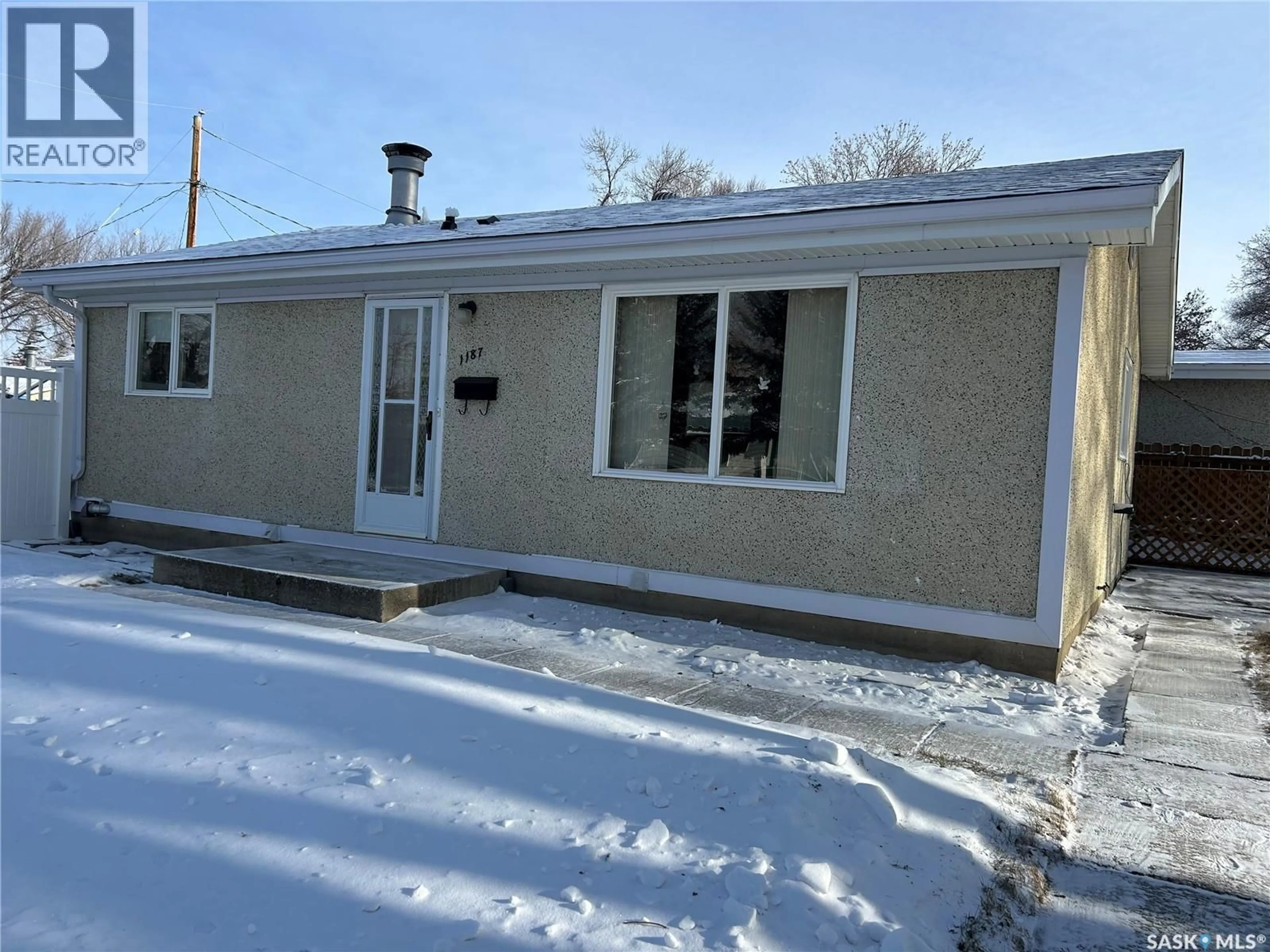 Home with vinyl exterior material, street for 1187 CURRIE CRESCENT, Moose Jaw Saskatchewan S6H5M9