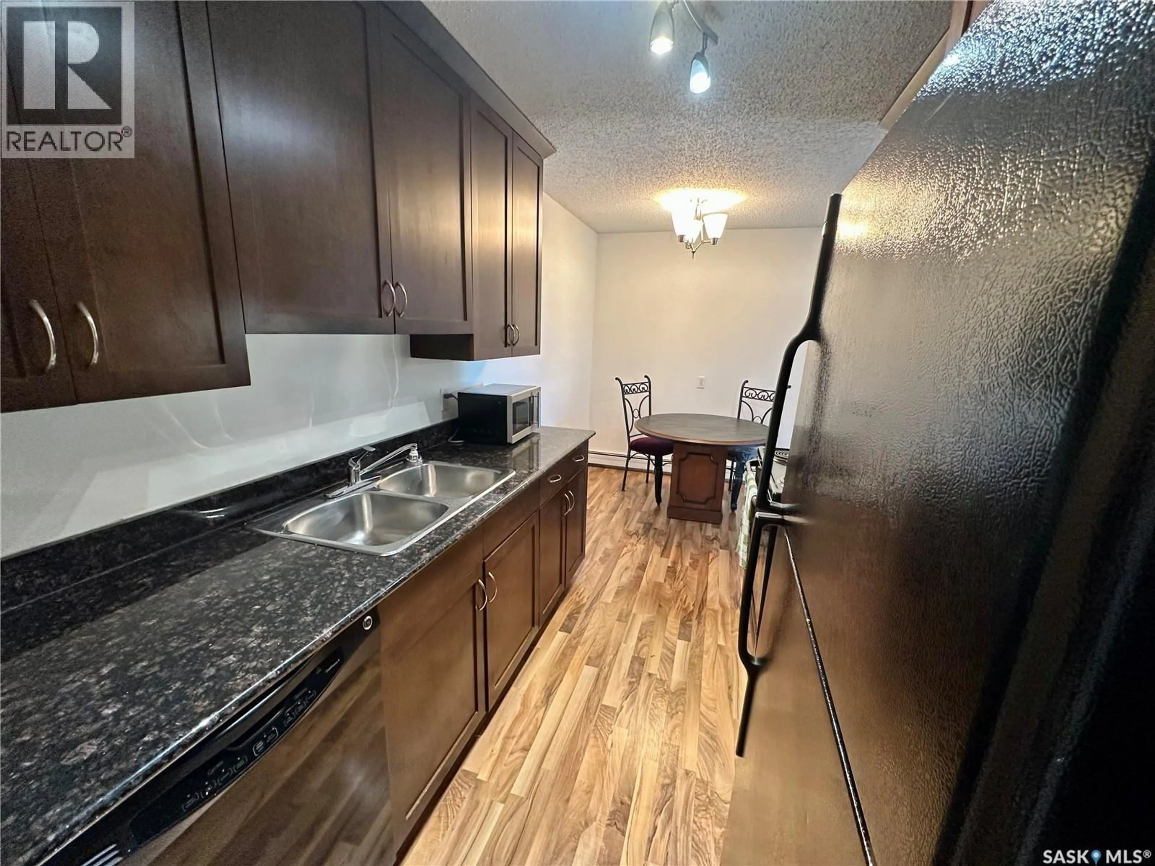 Standard kitchen, wood/laminate floor for 2233 - 307 ST HENRY AVENUE, Saskatoon Saskatchewan S7M5K6