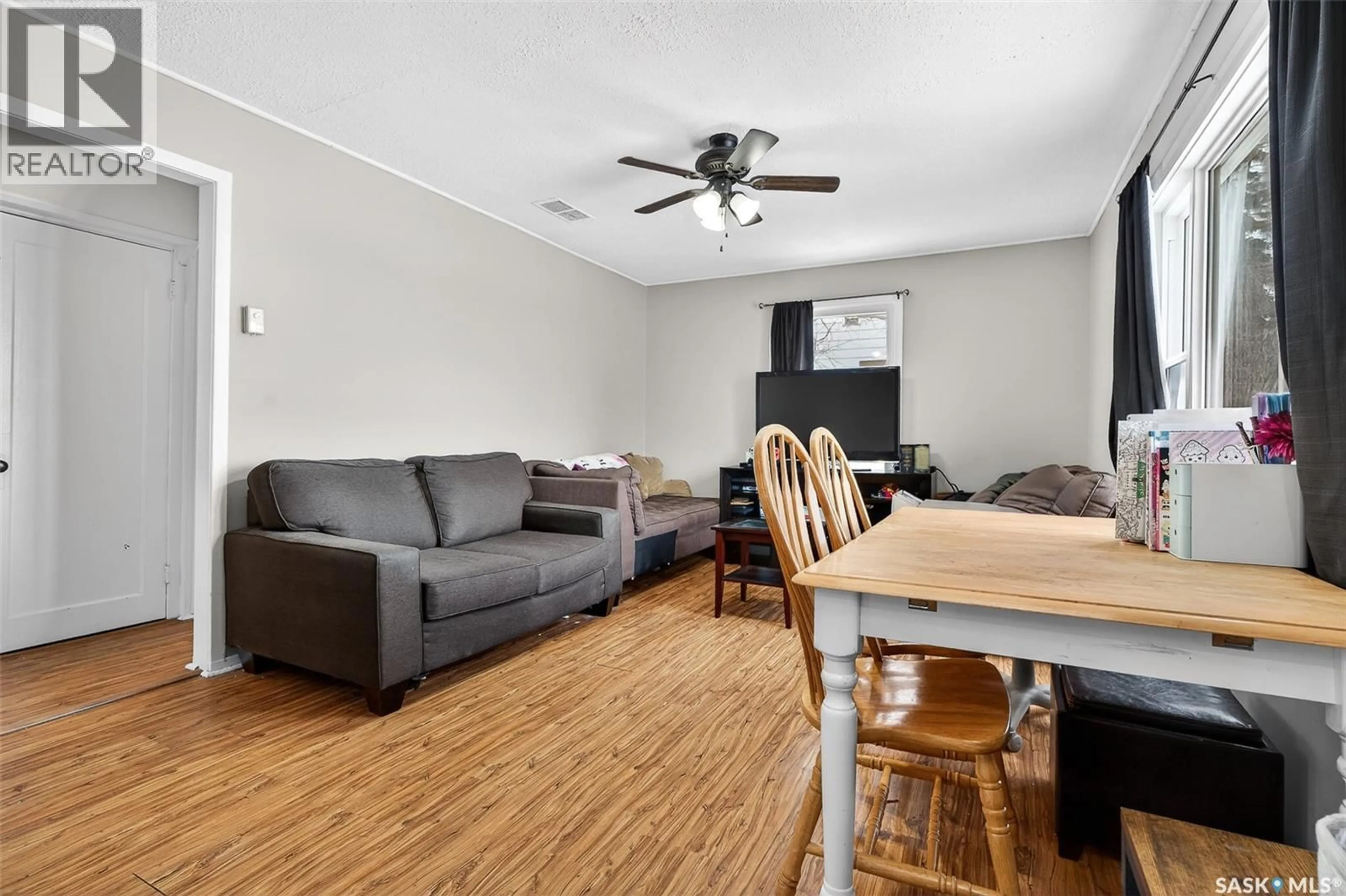 Living room with furniture, wood/laminate floor for 515 COTEAU STREET, Moose Jaw Saskatchewan S6H5E3