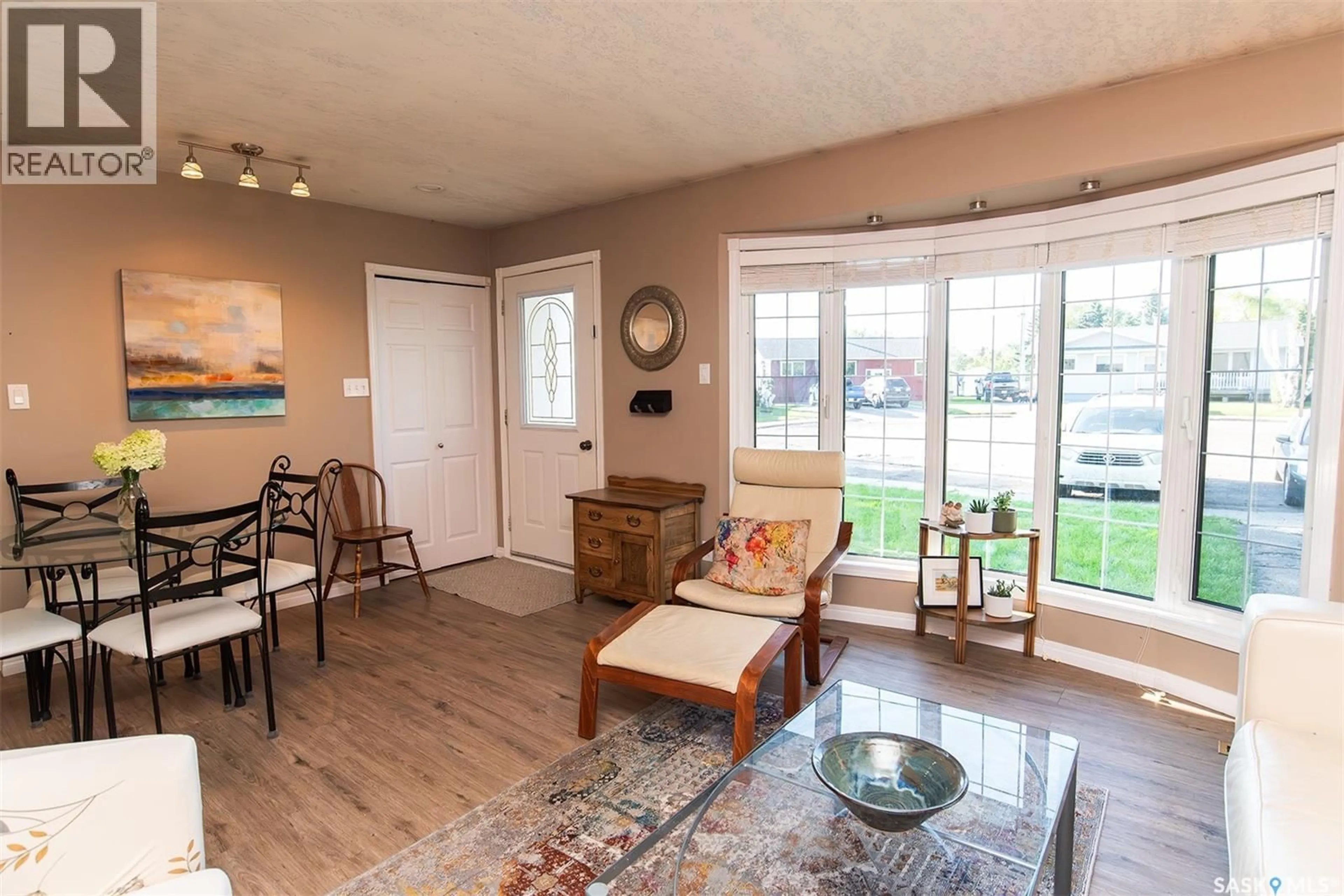 Living room with furniture, wood/laminate floor for 203 BROOKDALE PLACE, Wynyard Saskatchewan S0A4T0