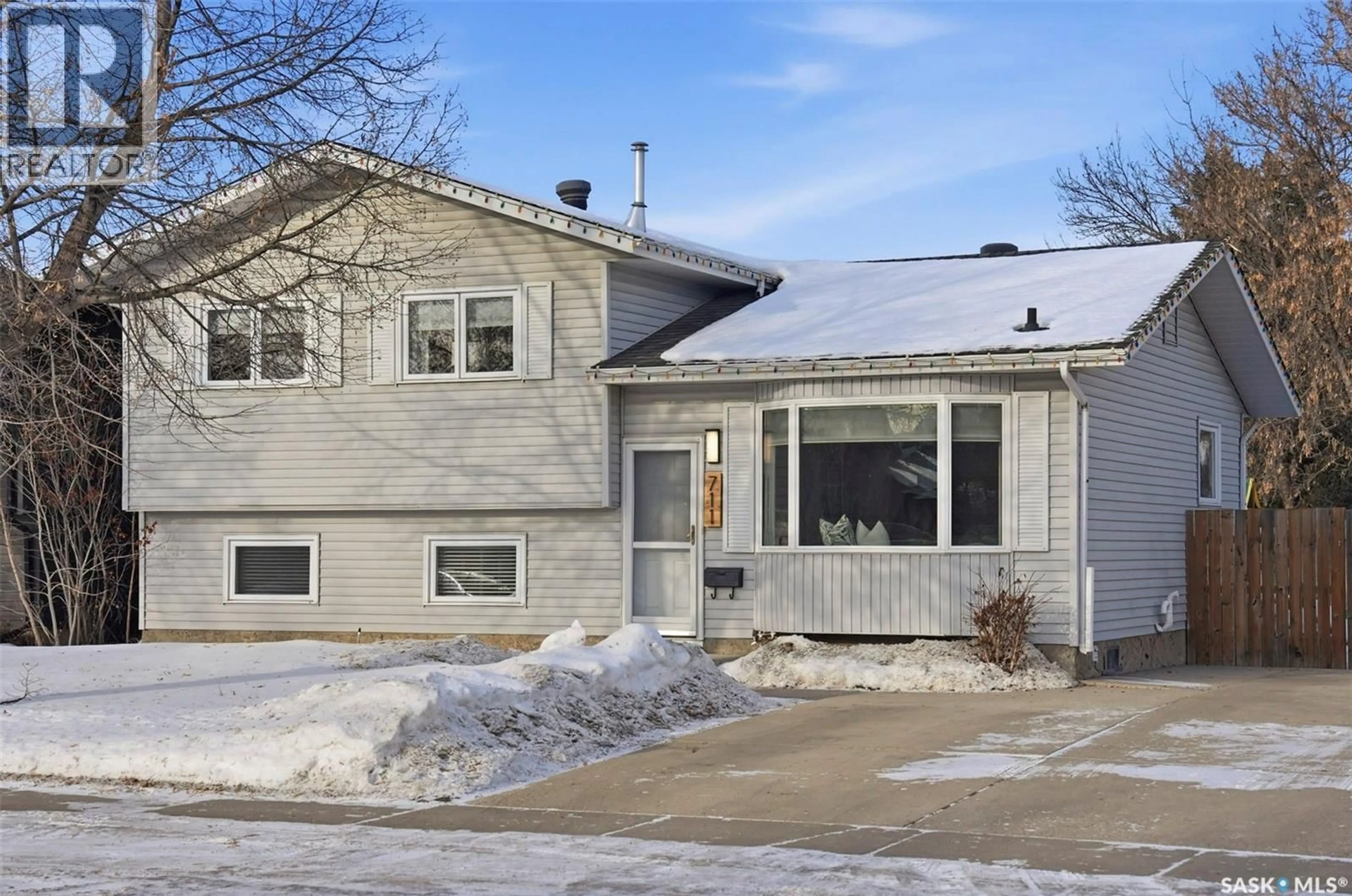Home with vinyl exterior material, street for 711 KERR ROAD, Saskatoon Saskatchewan S7N3R7