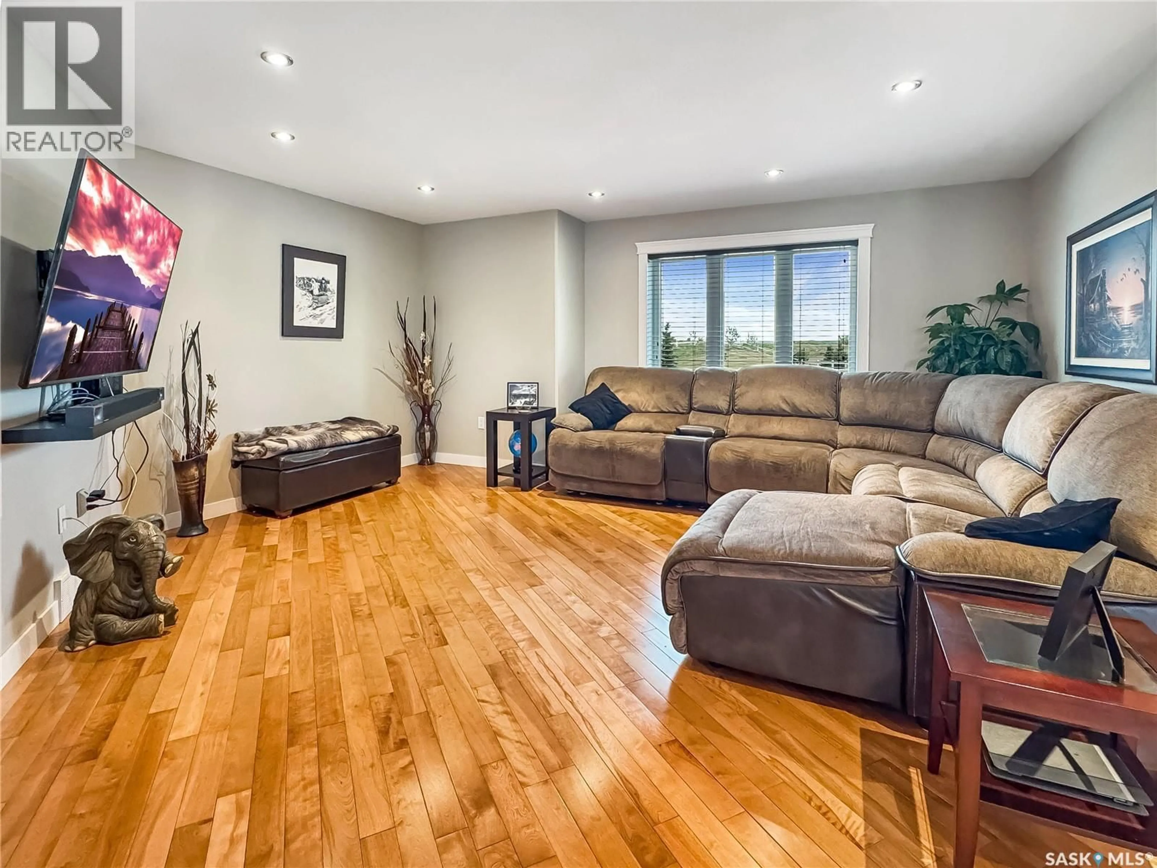Living room with furniture, wood/laminate floor for 6 BATTLE RIDGE ESTATES, Battle River Rm No. 438 Saskatchewan S0M0E0